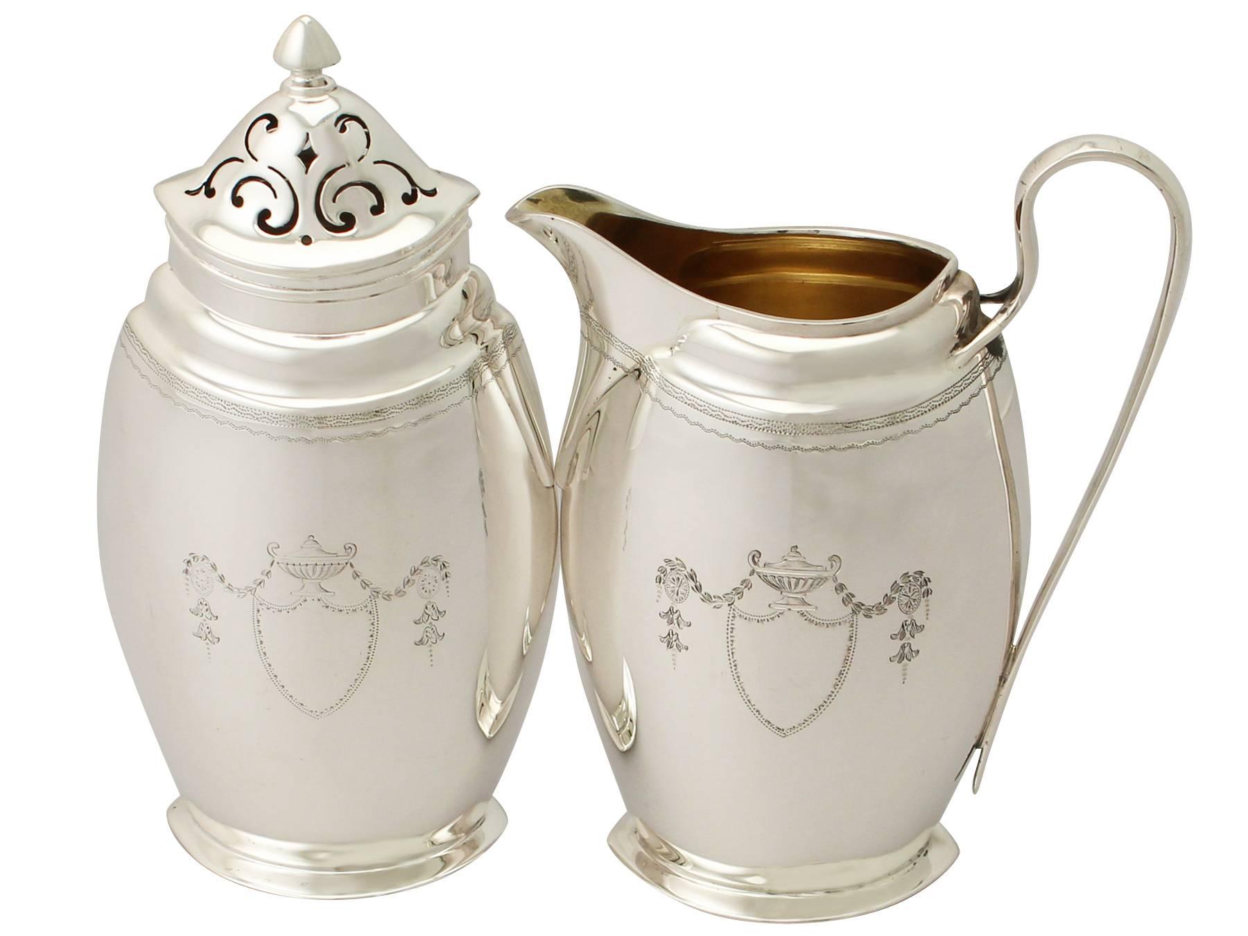 An exceptional, fine and impressive antique Edwardian English sterling silver creamer and sugar caster presentation set made by Edward Barnard & Sons Ltd. boxed; an addition to our antique teaware collection

This exceptional antique Edwardian