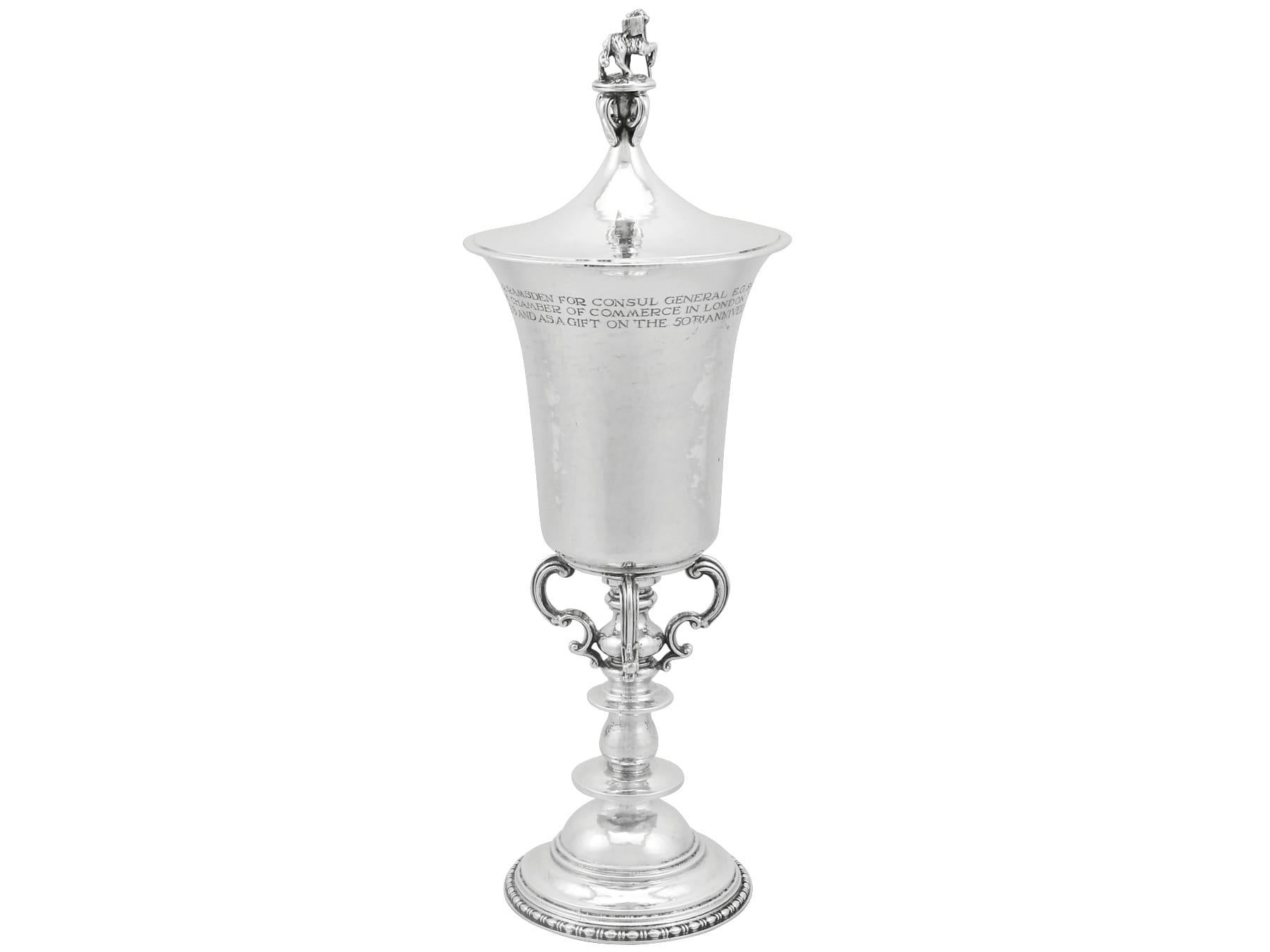 An exceptional, fine and impressive antique George V English sterling silver cup and cover made by Omar Ramsden; an addition to our diverse presentation silverware collection

This exceptional, fine and impressive antique silver cup and cover has