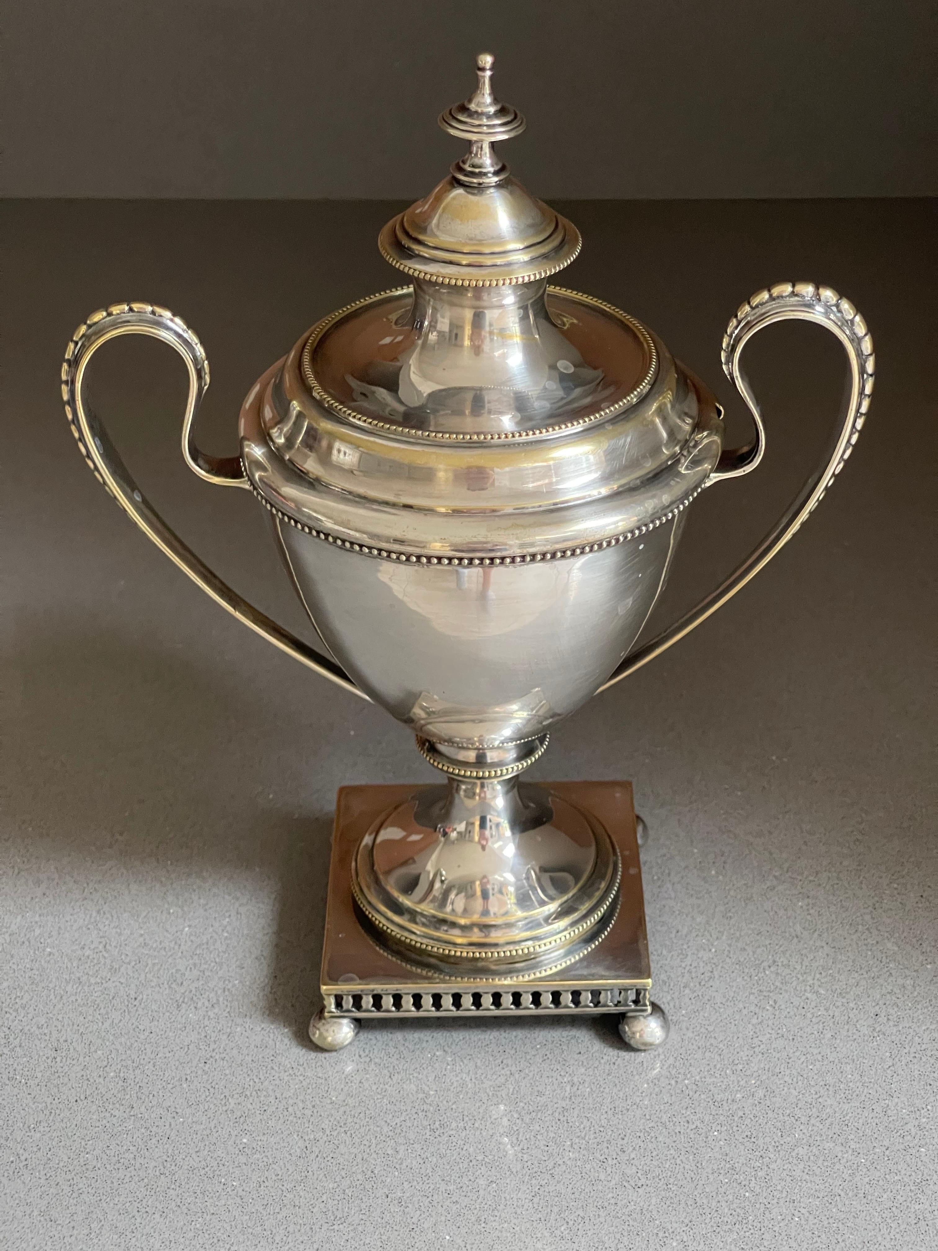 Antique silver cup or Decorative nu or fruit cup gilded inside with lid, pressed, cast and chased. Circular, curved feet with hinged. unstamped, tested with the scratch test, height approx. 28 cm, diameter 18 cm, weight approx. 317 g.