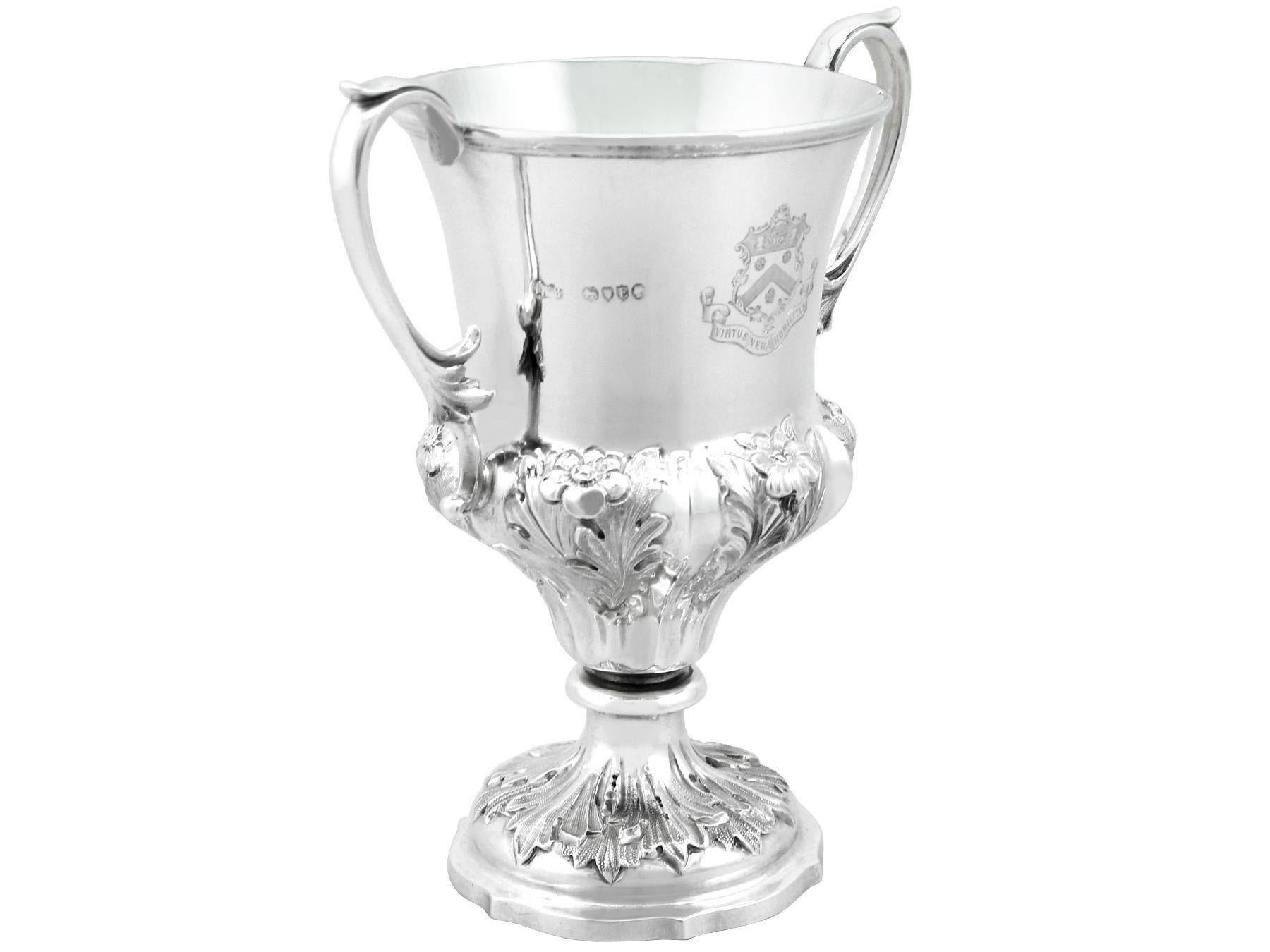 An exceptional, fine and impressive, antique Victorian English sterling silver cup; an addition to our Victorian silverware collection

This exceptional antique Victorian sterling silver presentation cup has a campania shaped form to a circular