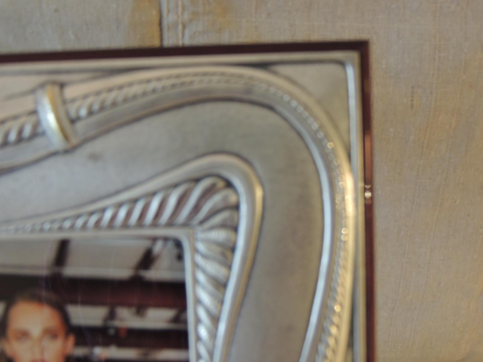 Antique sterling silver decorative picture frame by Bruno Castellani
With rosewood lacquered backing and brass fittings.
Size: 11
