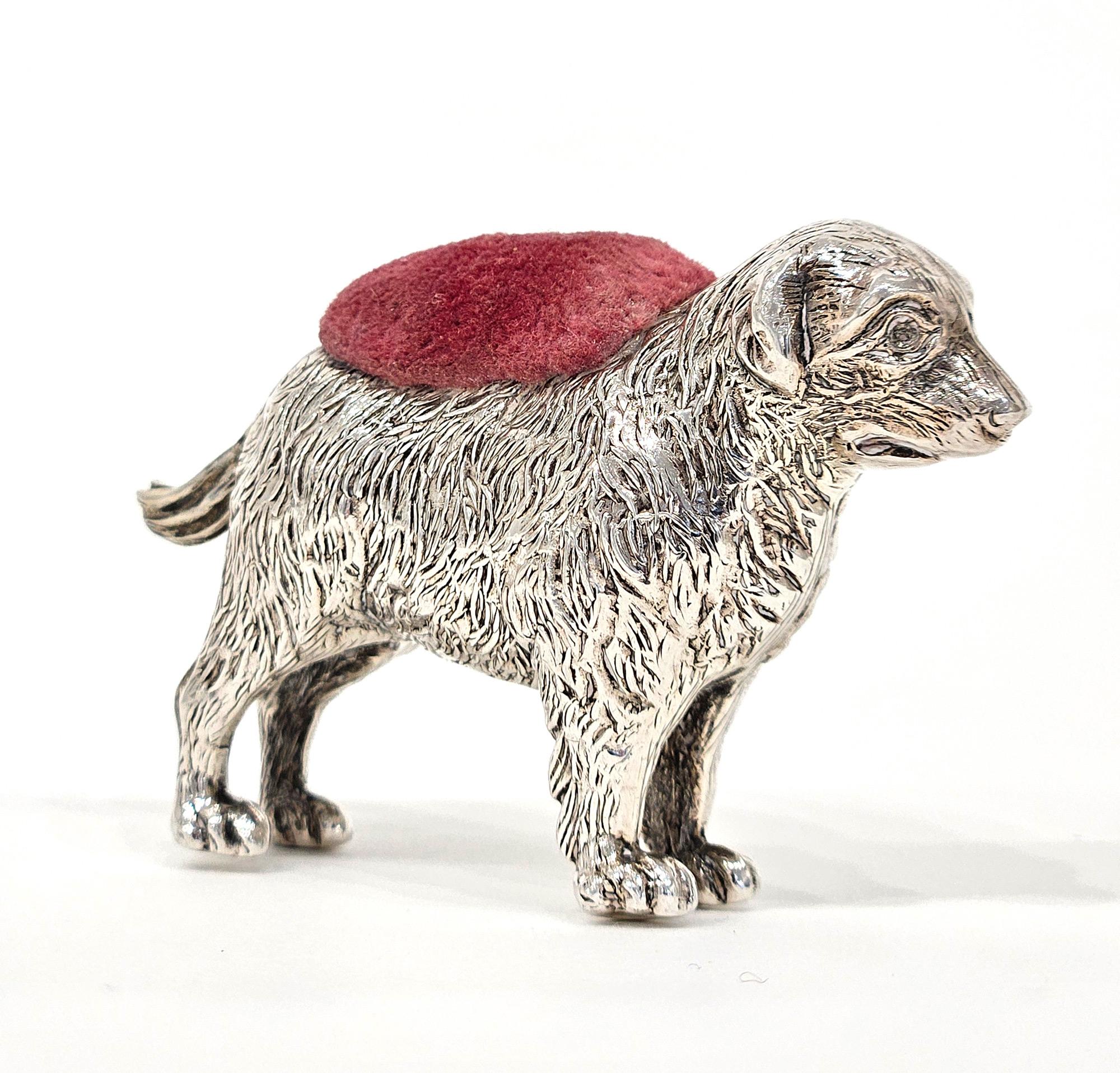 A very rare and highly collectible Edwardian novelty silver pin cushion in the form of a dog, made by Adie & Lovekin in Birmingham in 1909. The dog is very delicately modelled in sterling silver. It is usually considered to be modelled on a