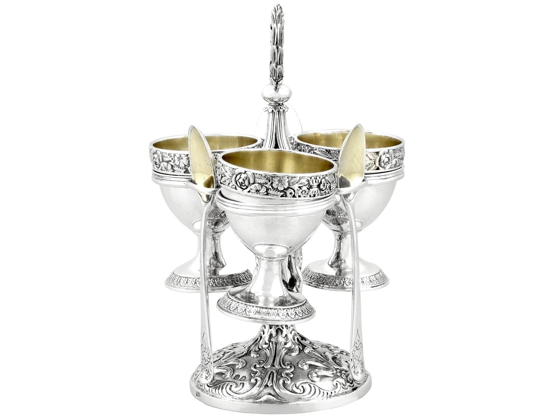 An exceptional, fine and impressive, antique George IV English sterling silver egg cruet set for three persons; part of our dining silverware collection.

This exceptional antique George IV sterling silver egg cruet set consists of three egg cups