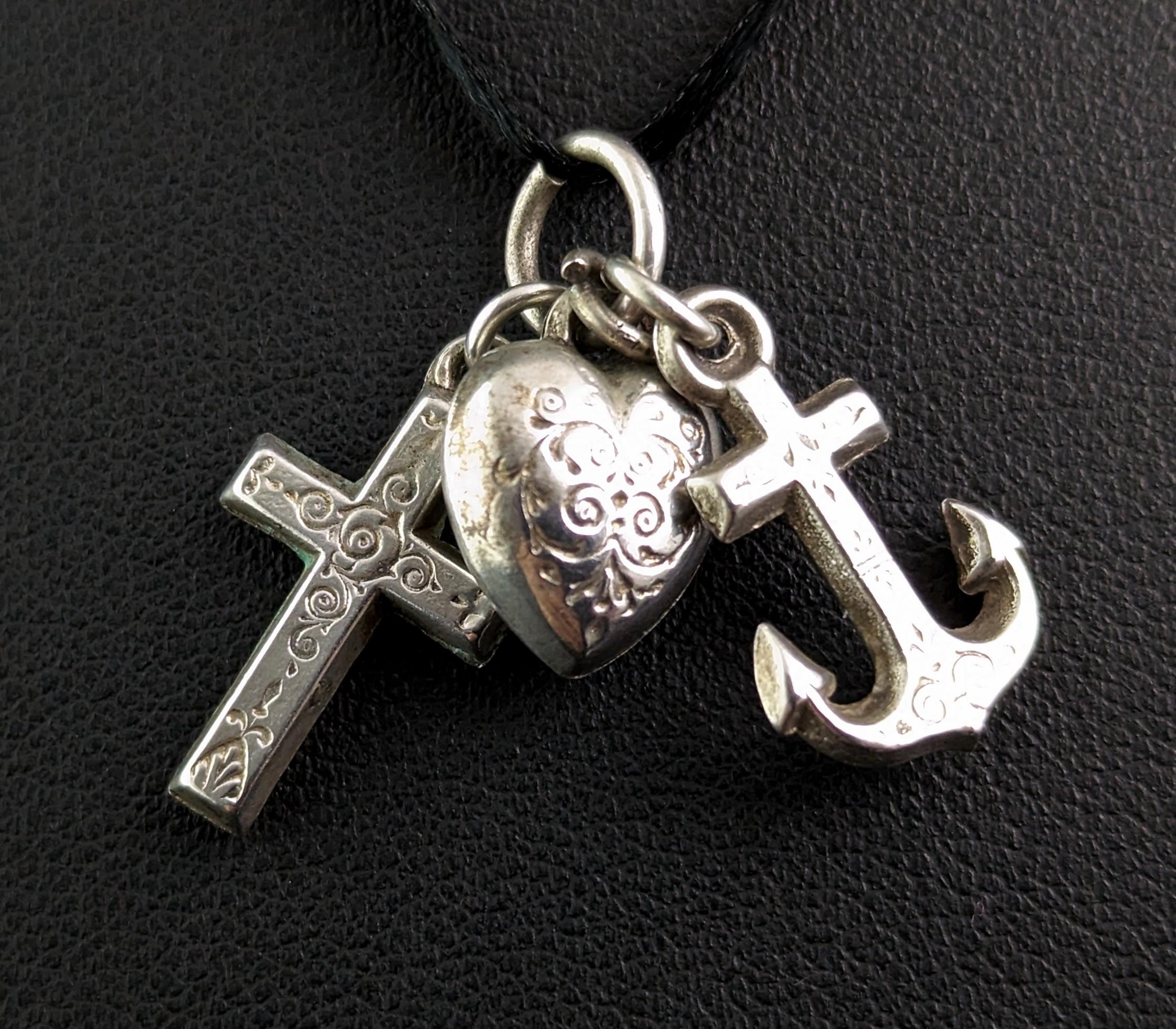 This sweet little antique Faith, Hope and Charity charm is embued with Victorian symbolism.

Each piece is finely engraved back and front giving a wonderfully detailed touch, the charm would also make a great dainty pendant to hang from a fine