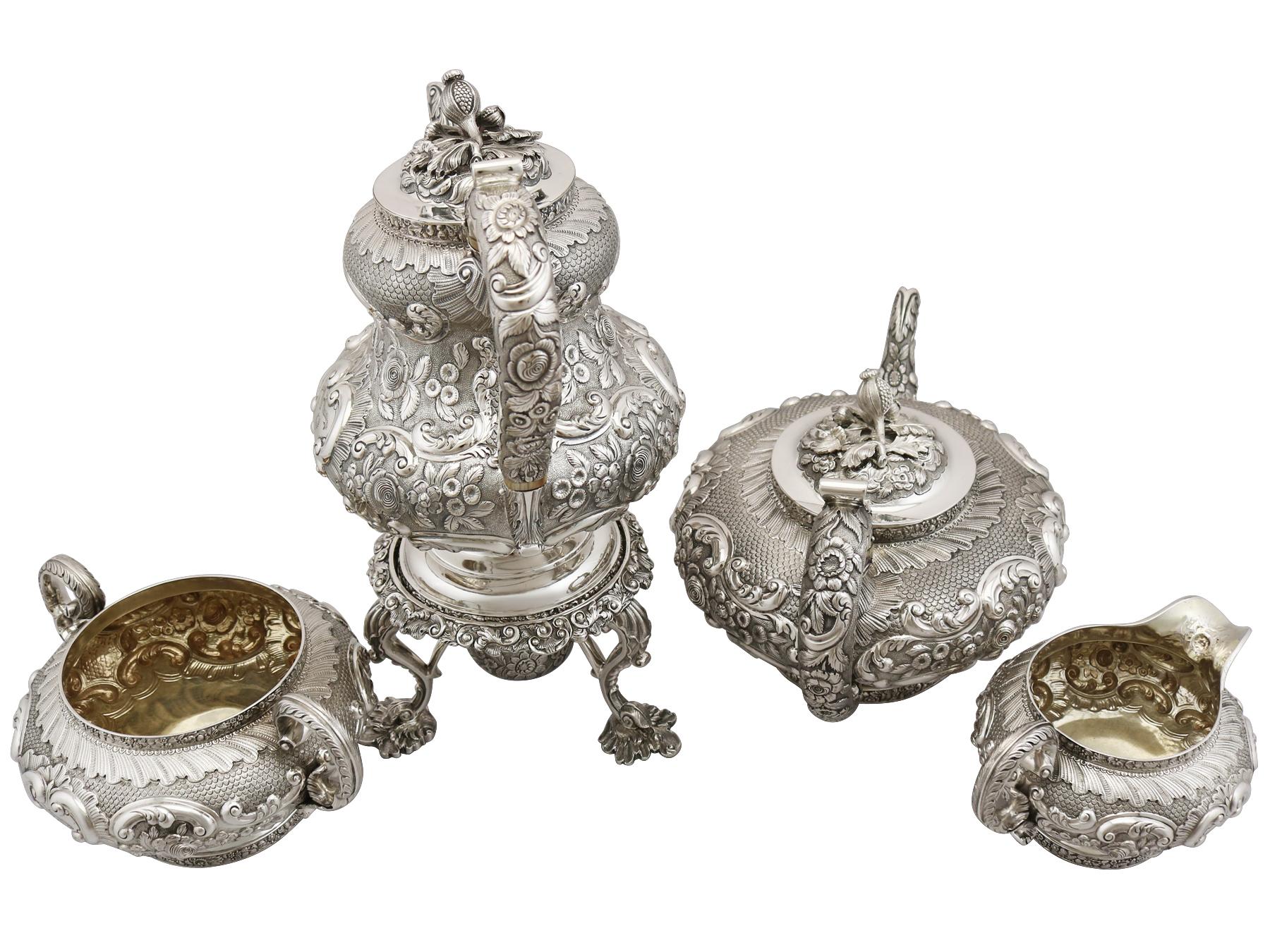 A magnificent, fine and impressive antique George IV English sterling silver four piece tea and coffee set/service; part of our silver Teaware collection.

This magnificent antique silver tea set, in sterling standard, consists of a coffee pot