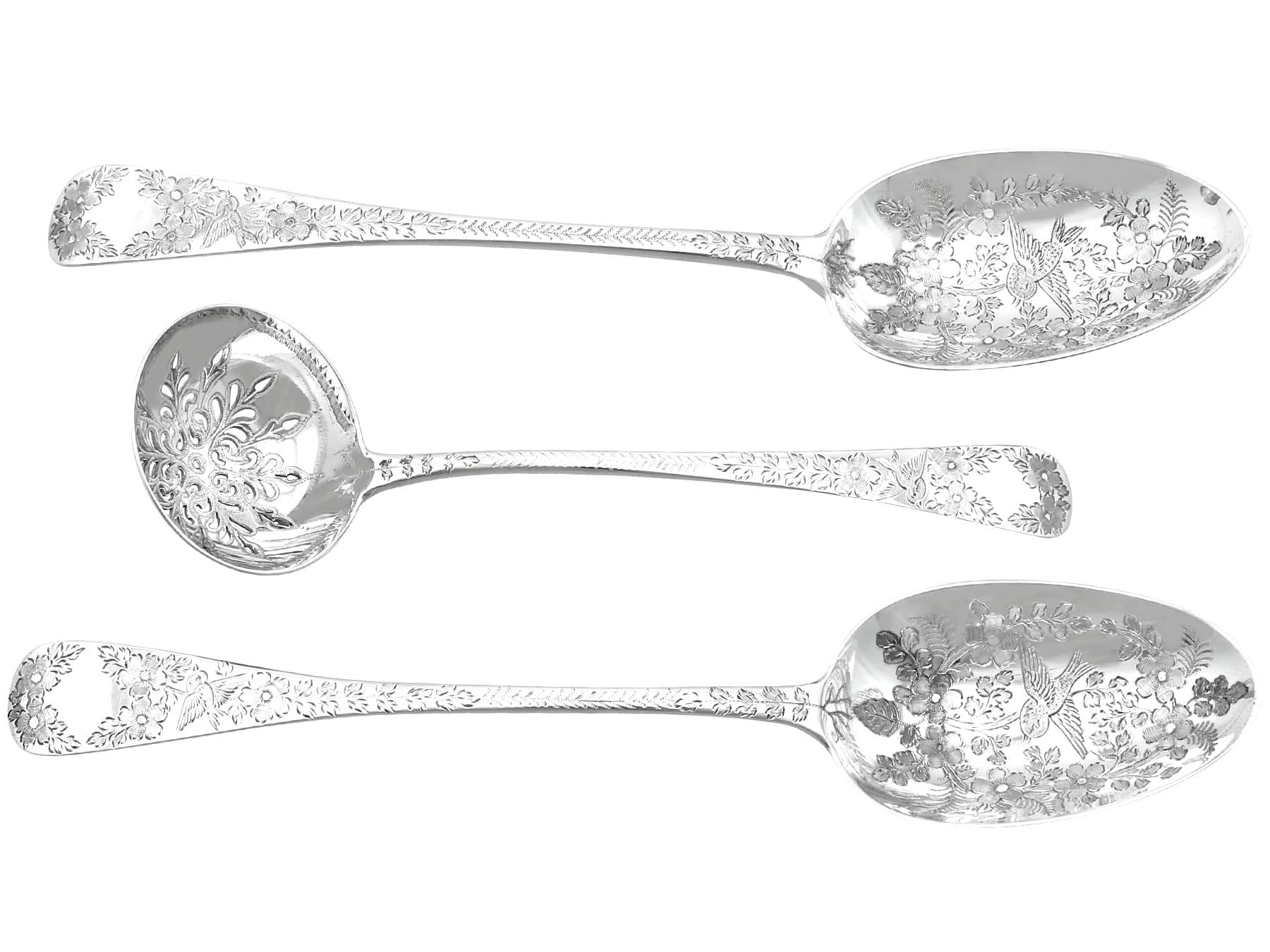 An exceptional, fine and impressive pair of antique Victorian English sterling silver fruit / dessert serving set; an addition to our silver flatware collection

This exceptional antique Victorian sterling silver fruit serving set consists of a pair
