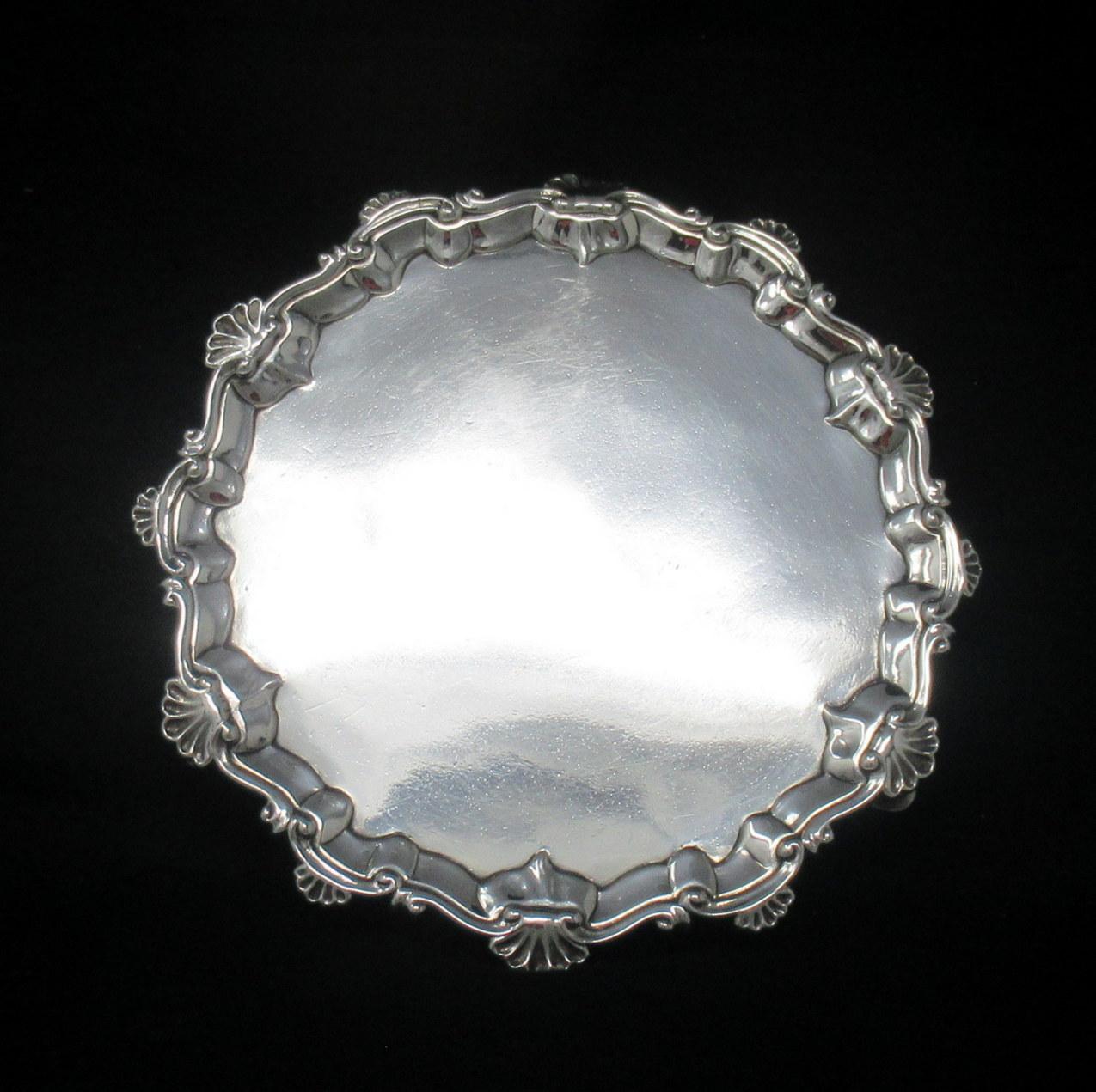 A superb Example of an early Georgian Eighteenth Century heavy gauge Sterling Silver Card Tray of outstanding quality and condition for such an early silver item. 

The shaped circular form with stylish pie crust rim detailing, edged with scroll and