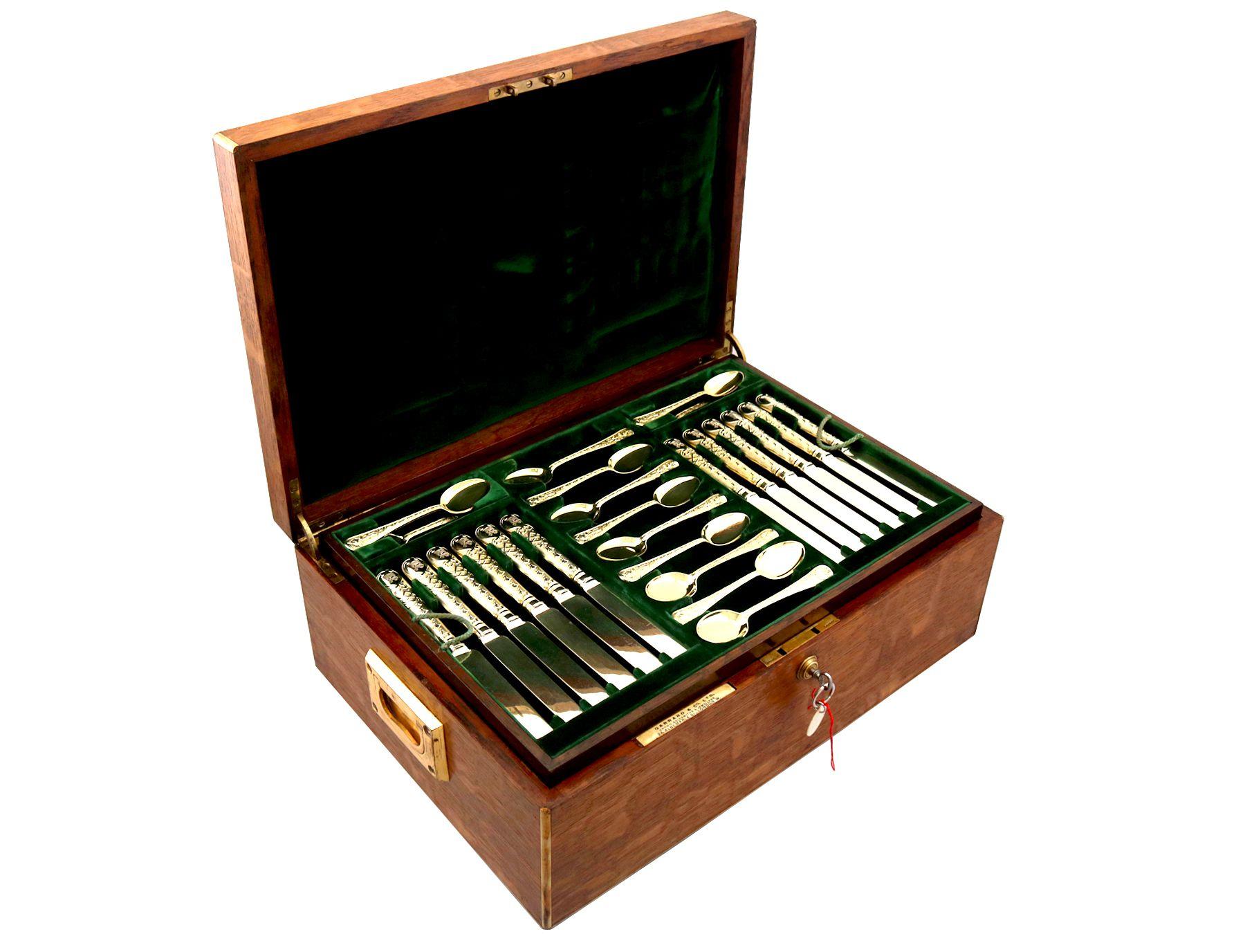 A magnificent, fine and impressive antique early 20th century English sterling silver gilt Elizabethen II pattern flatware service for twelve persons - boxed; an addition to our canteen of cutlery collection.

The pieces of this magnificent,
