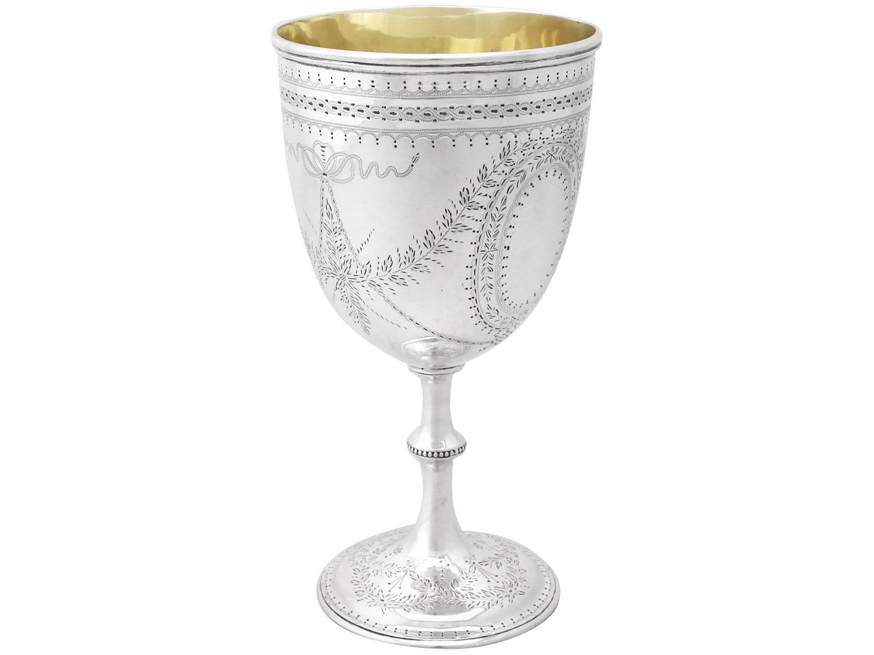 An exceptional, fine and impressive, large antique Victorian English sterling silver goblet; an addition to our collection of wine and drinks related silverware 

This exceptional antique Victorian sterling silver goblet has a circular bell shaped