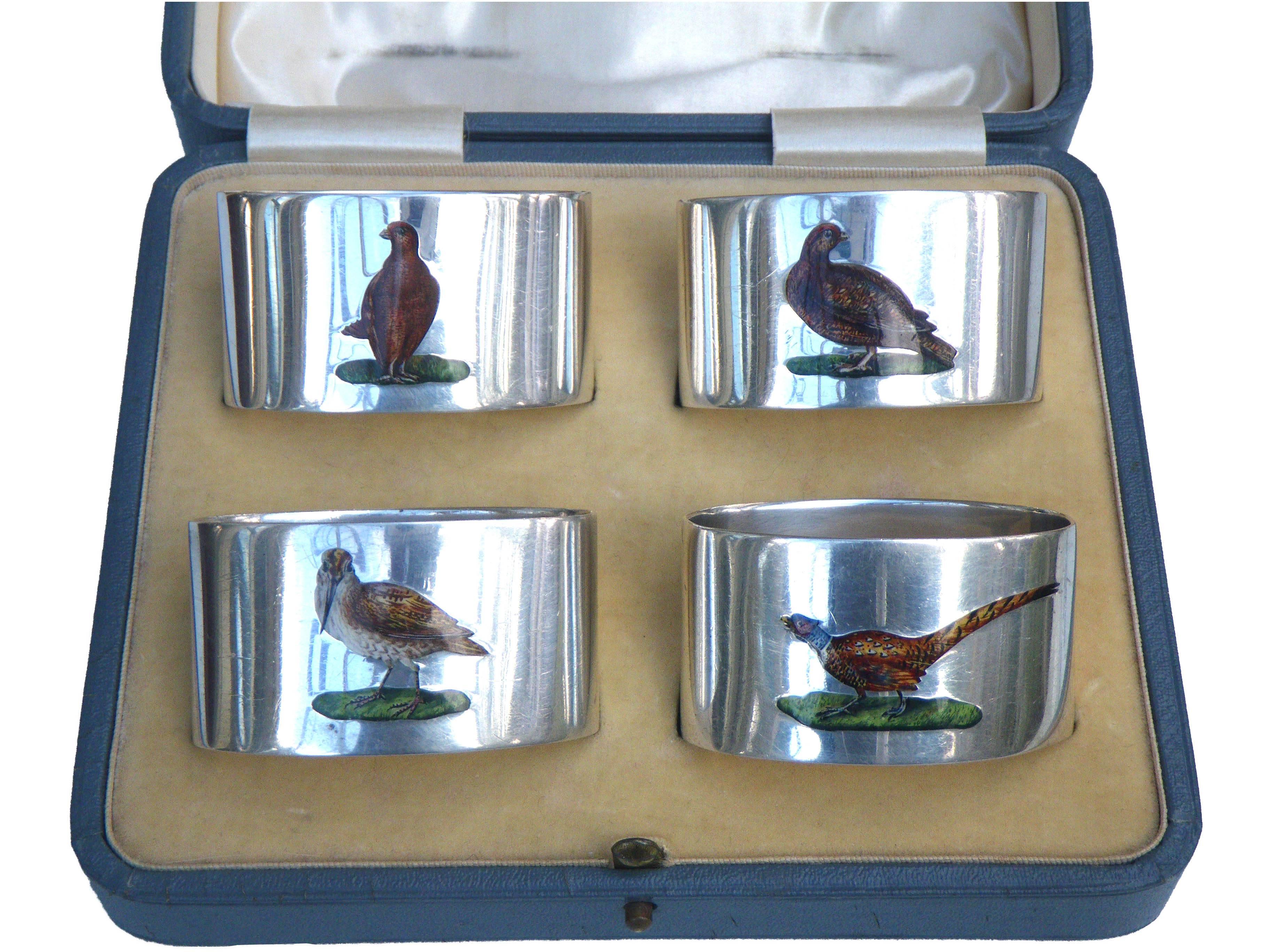 A very rare, superb set of hand enamelled sterling silver heavy quality napkin rings depicting four different game birds, namely
Snipe, Pheasant, Partridge, Grouse

Made by Stokes & Ireland Ltd (William Henry Stokes & Arthur George Ireland) in