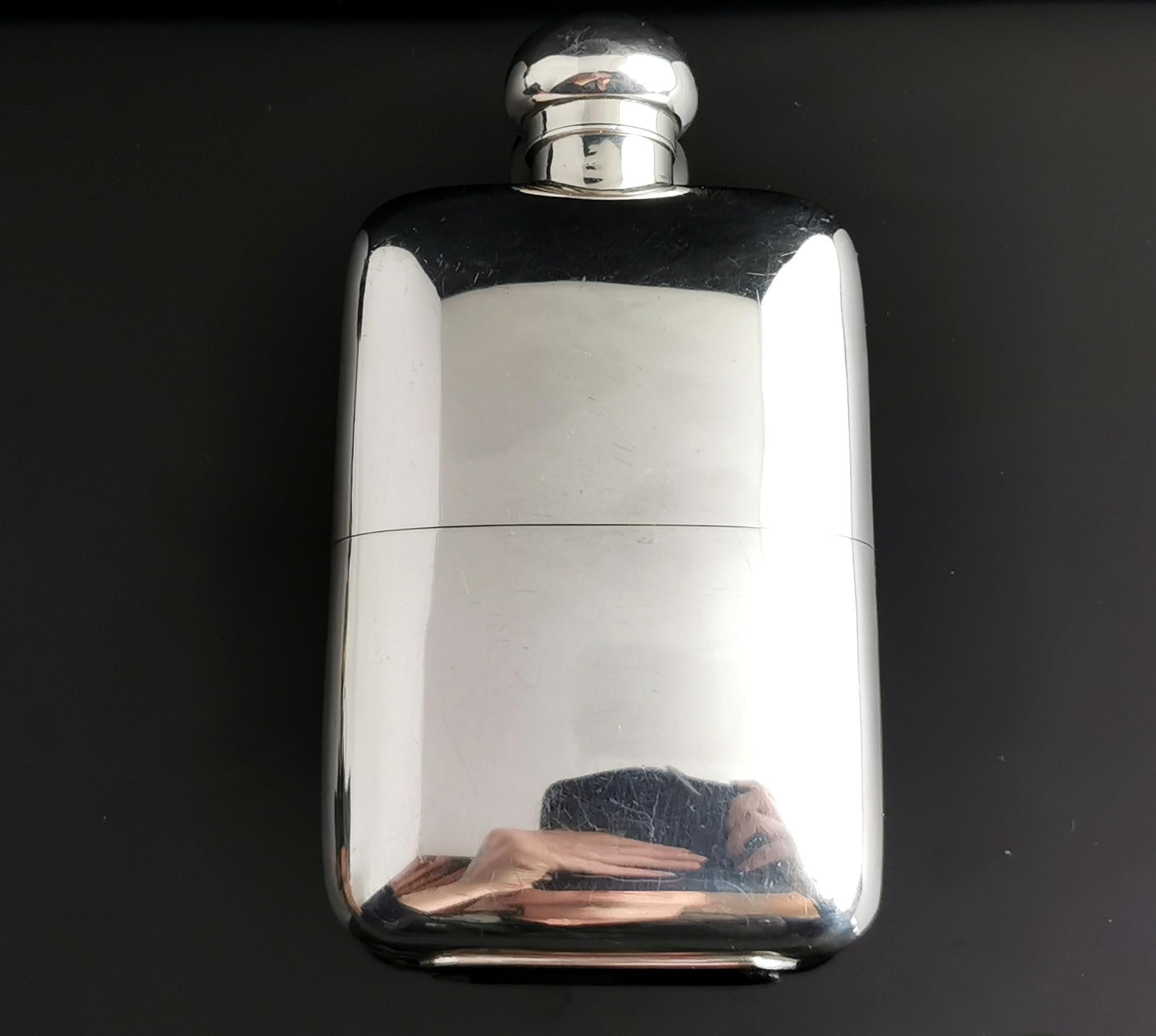 A handsome antique, early Art Deco sterling silver hip flask.

It has a smooth polished design with rounded corners, a curved ergonomic shaped body and screw bayonet cap.

The hip flask has a removable gilt lined sterling silver beaker designed to
