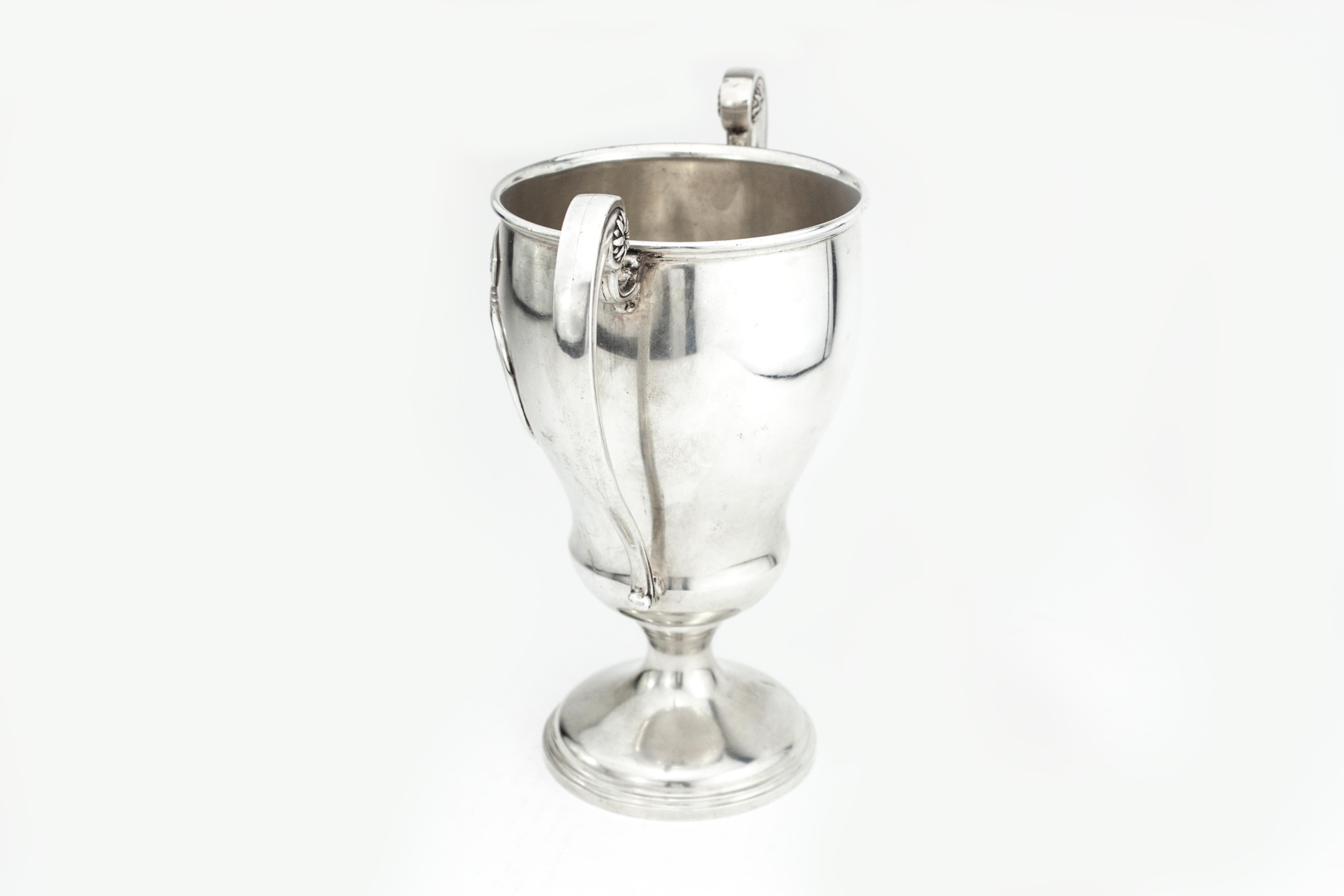 Antique sterling silver HOVIS Ltd. trophy 
Maker: Bravingtons Ltd.
Made in London, 1931
Fully hallmarked.

Dimensions - 
Length 19.5 cm 
Width 10.5 cm
Height 20 cm
Weight: 504 grams

Condition: Minor wear from general usage, age-related