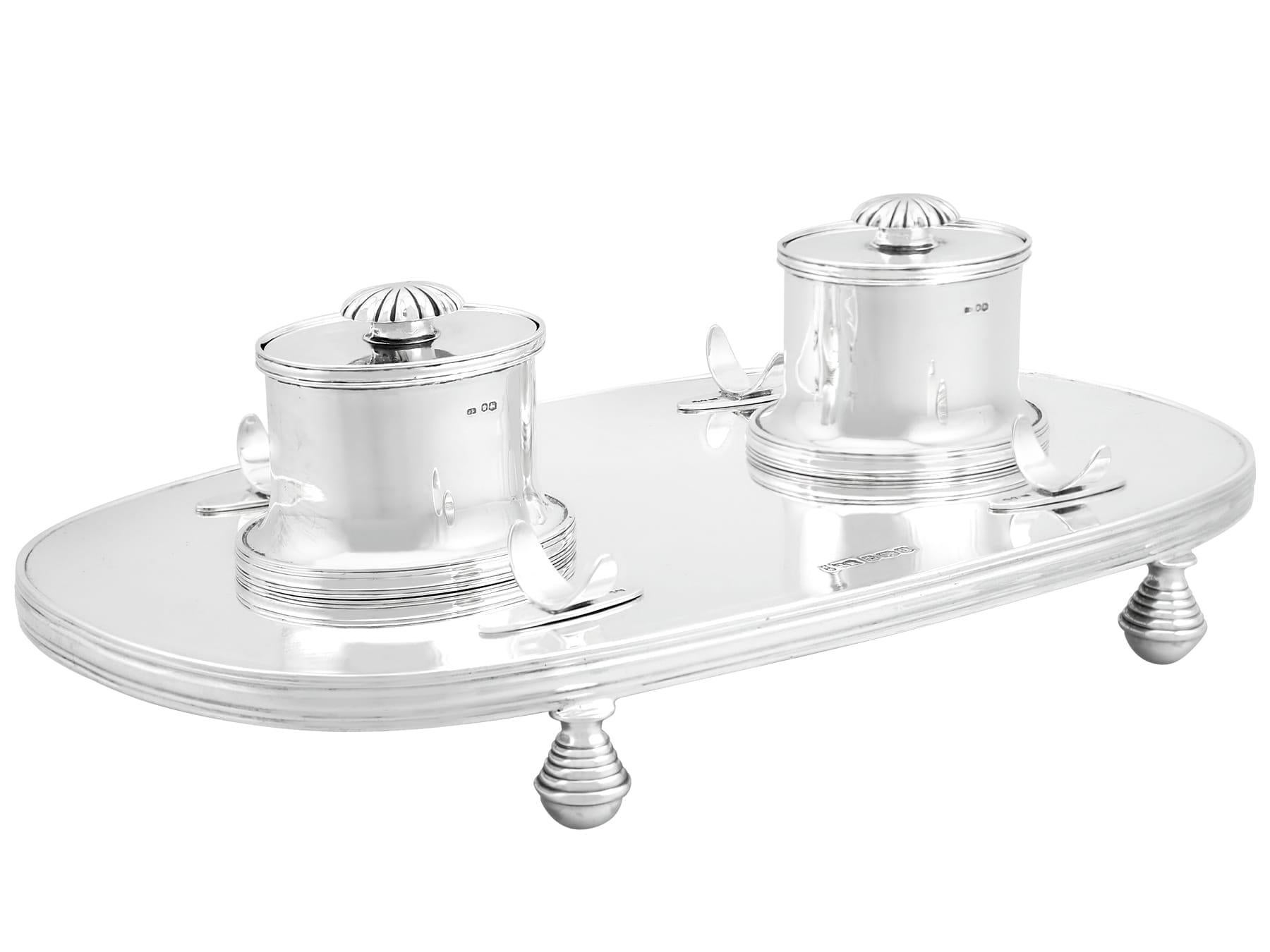 An exceptional, fine and impressive antique George V English sterling silver inkstand; an addition to our ornamental office silverware collection

This exceptional, fine and impressive antique George V sterling silver inkstand has a plain oval