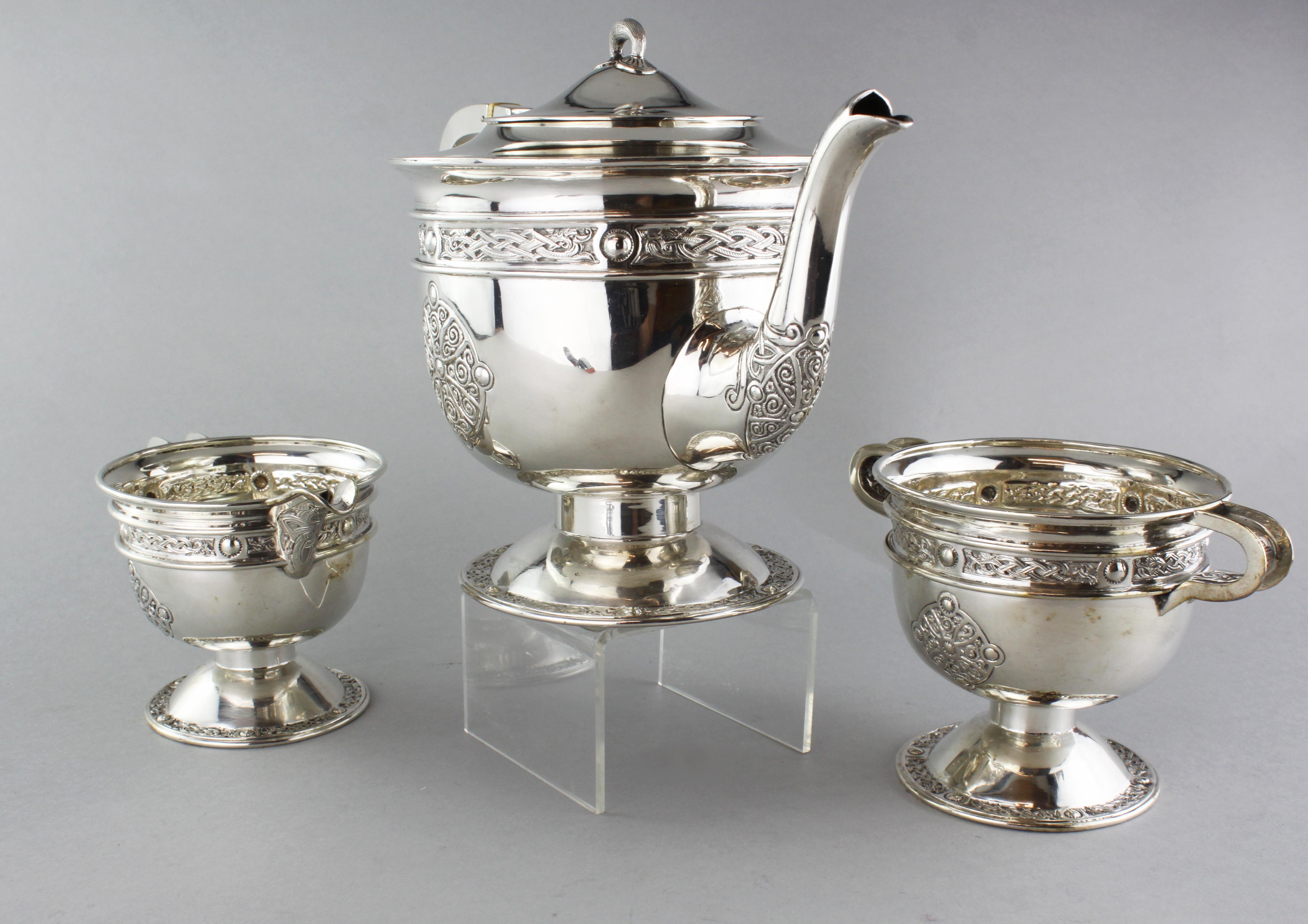 Antique sterling silver Irish three-piece tea service set
Maker: Hopkin & Hopkins
Made in Dublin, 1917
Fully hallmarked.

Dimensions:
Sugar bowl
- Weight 218g
- Base width 7.8cm
- Height 9.5cm

Teapot:
- Weight 645g
- Base width