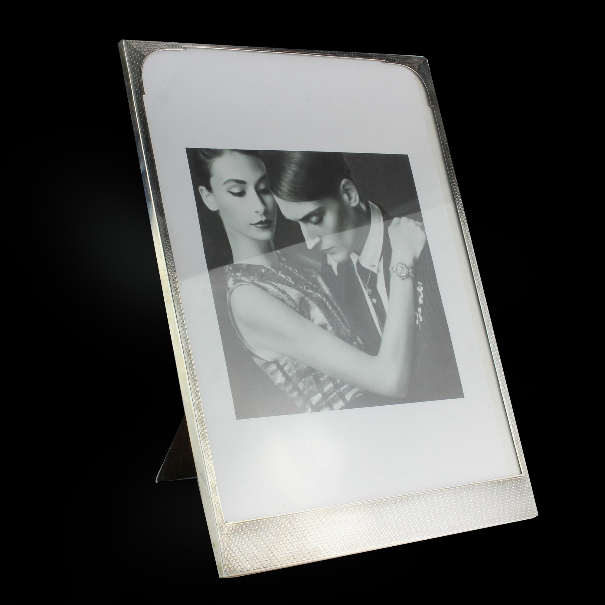 Antique sterling silver large picture frame

Made in England, Birmingham, 1927
Makers: Ernest Wilfred Sanders & Henry Arthur Mackenzie of Sanders & Mackenzie.
Fully hallmarked.


This photograph frame is fitted with a fine and impressive oak