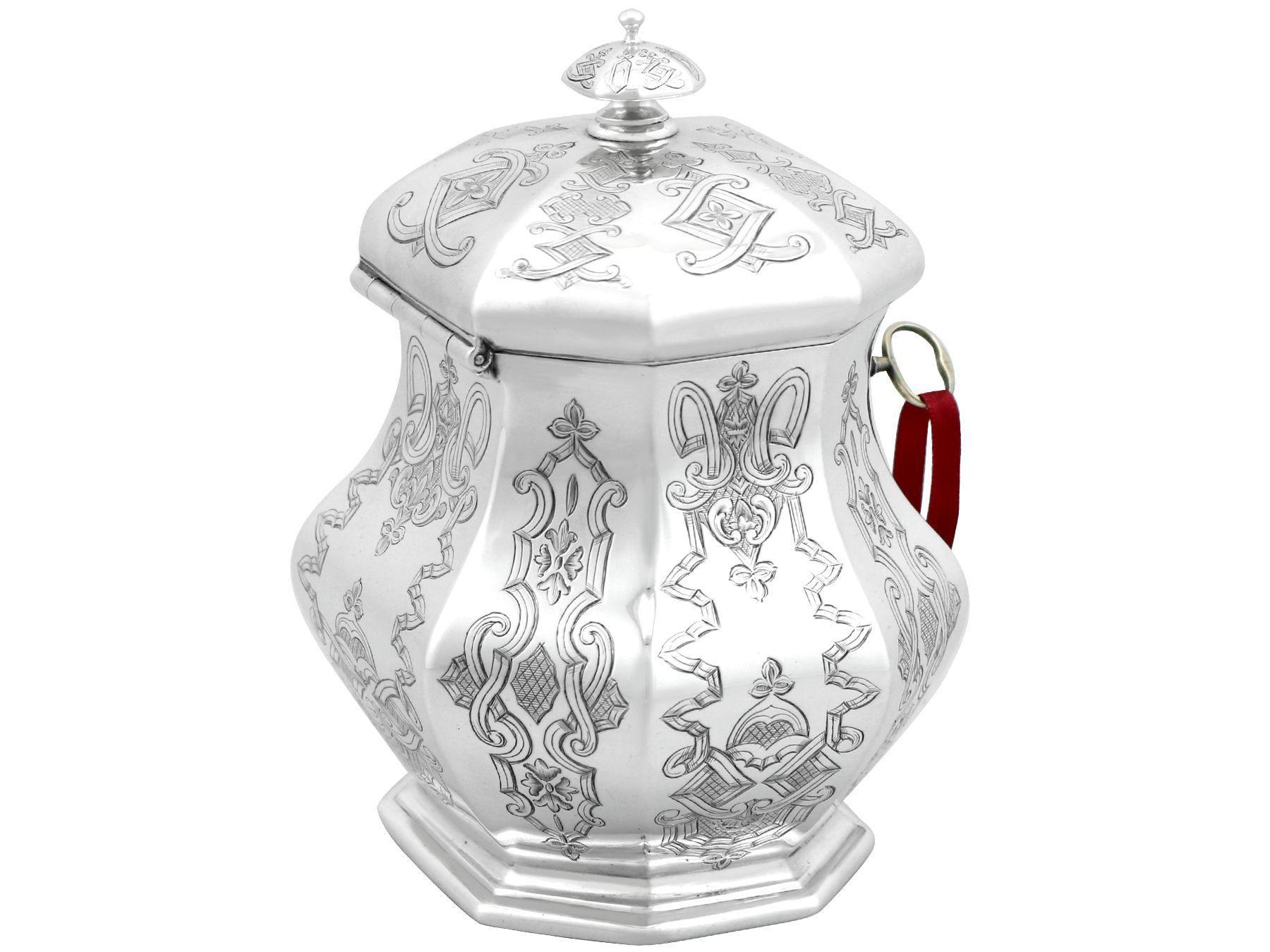 An exceptional, fine and impressive, antique early Victorian English sterling silver locking tea caddy; an addition to our silver teaware collection.

This exceptional antique Victorian sterling silver tea caddy has an octagonal panelled, baluster