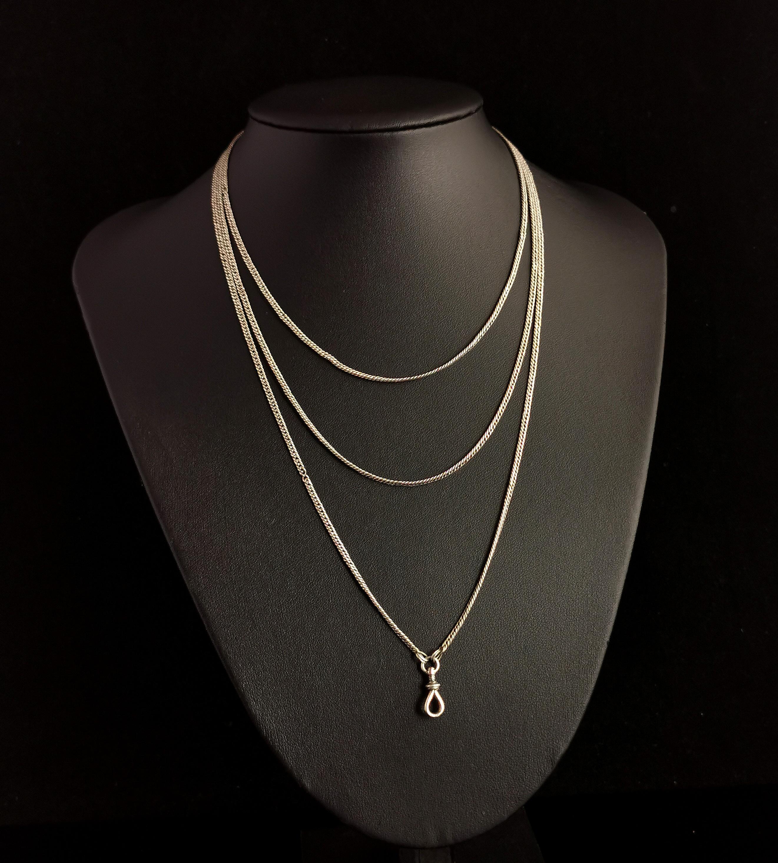 A gorgeous antique silver longuard chain or muff chain necklace.

This is a lovely long length chain at 53