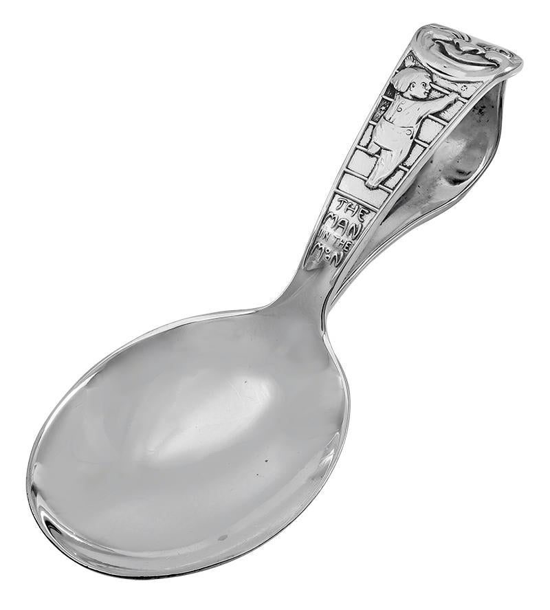 Antique sterling silver baby spoon, with a curved feeding handle.  Showing a big smiling moon face, with a child climbing a ladder to the moon.  Engraved letters:  