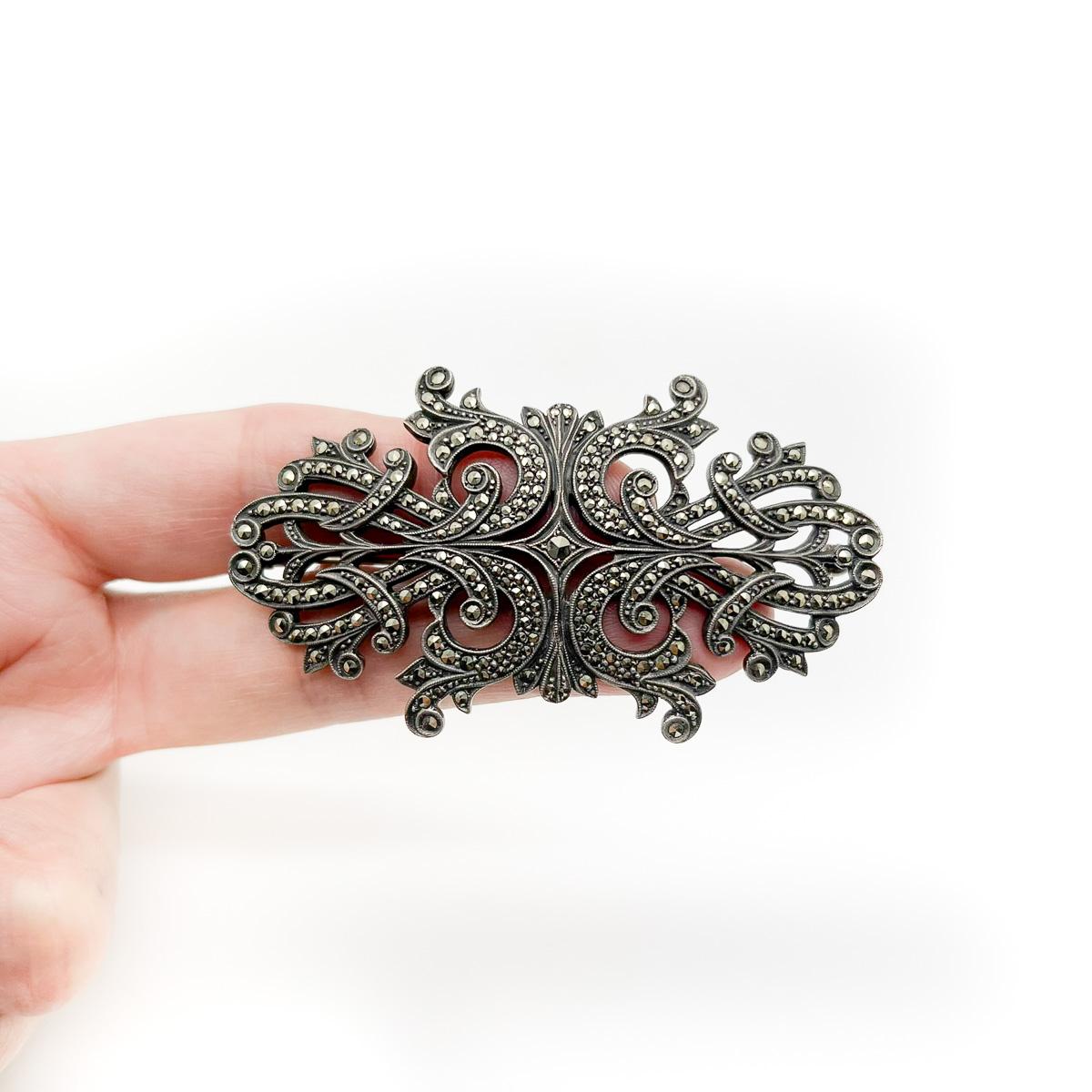 A large Antique marcasite panel brooch. A stunning example of marcasite work from the 1920s. Beautifully designed, weighty solid silver, set with high quality marcasite stones. A fabulous style statement.
An unsigned beauty. A rare treasure. Just