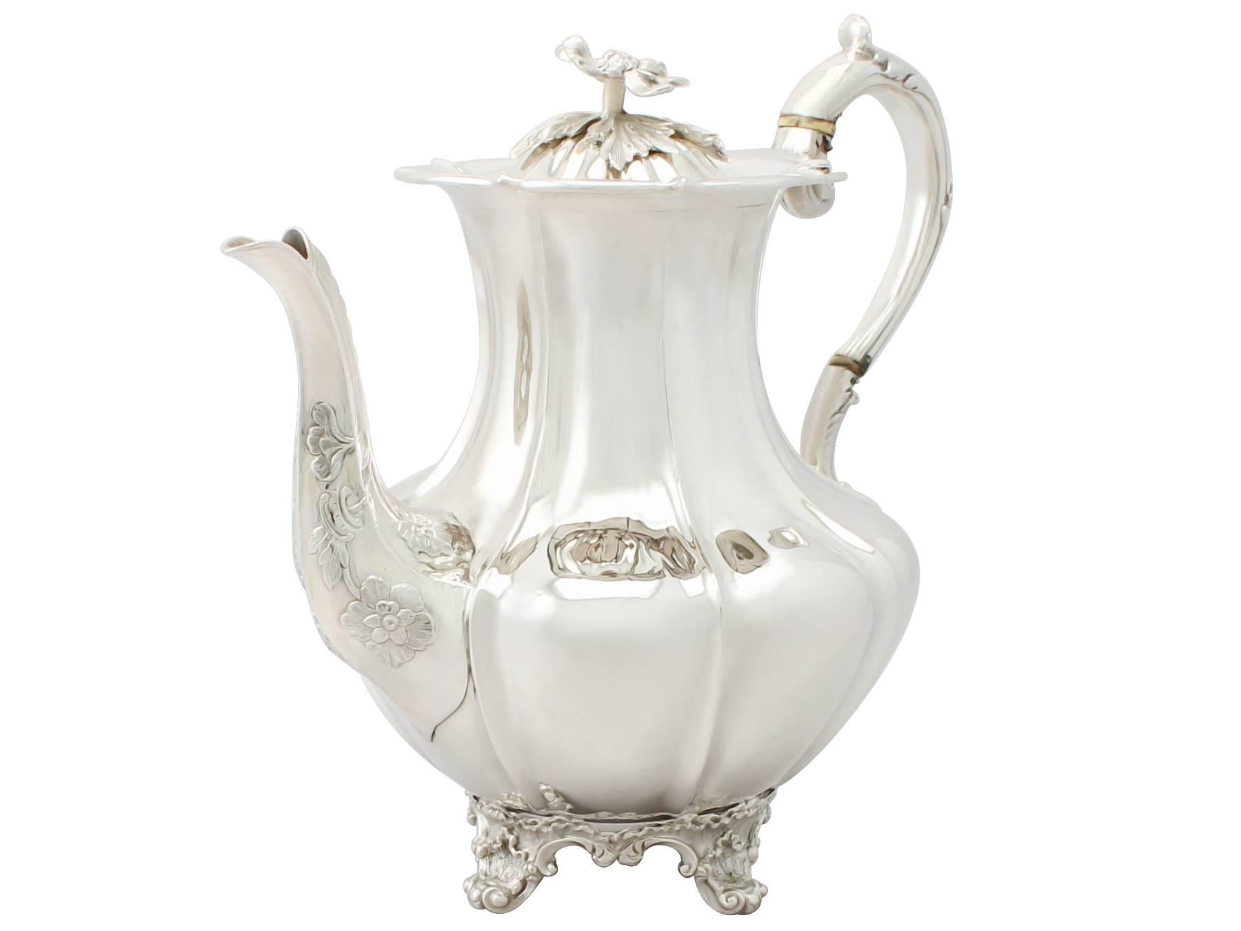 An exceptional, fine and impressive antique English sterling silver melon style four-piece tea and coffee service / set; part of our silver teaware collection.

This exceptional antique English sterling silver tea and coffee service consists of a