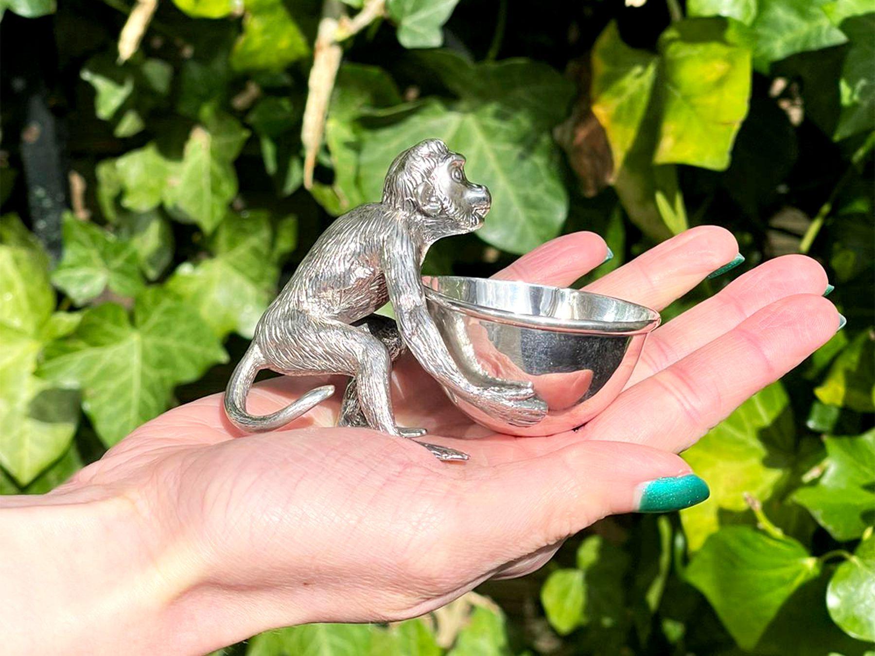 An exceptional, fine and impressive antique Victorian English cast sterling silver bowl modelled in the form of a monkey; an addition to our novelty silverware collection.

This exceptional antique Victorian cast sterling silver receptacle bowl