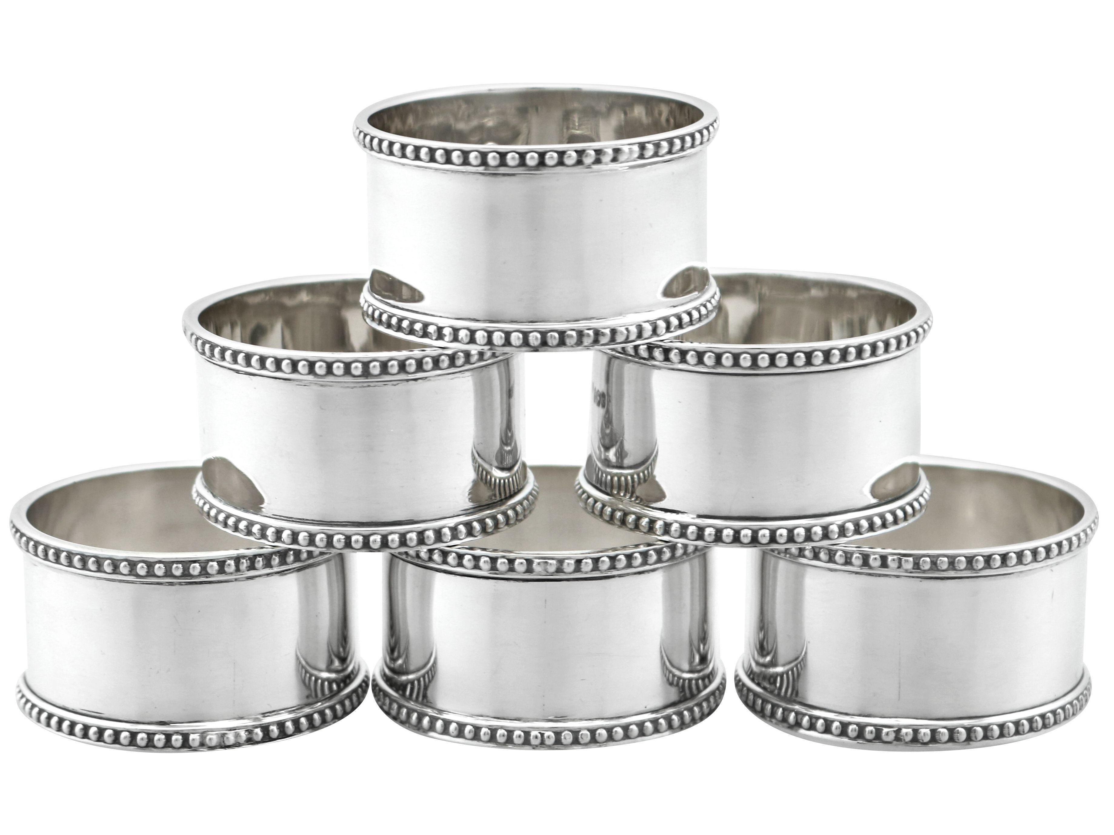 An exceptional, fine and impressive set of six antique George V sterling silver napkin rings - boxed; an addition to our dining silverware collection

This exceptional set of antique George V silver napkin rings consists of six napkin rings, each