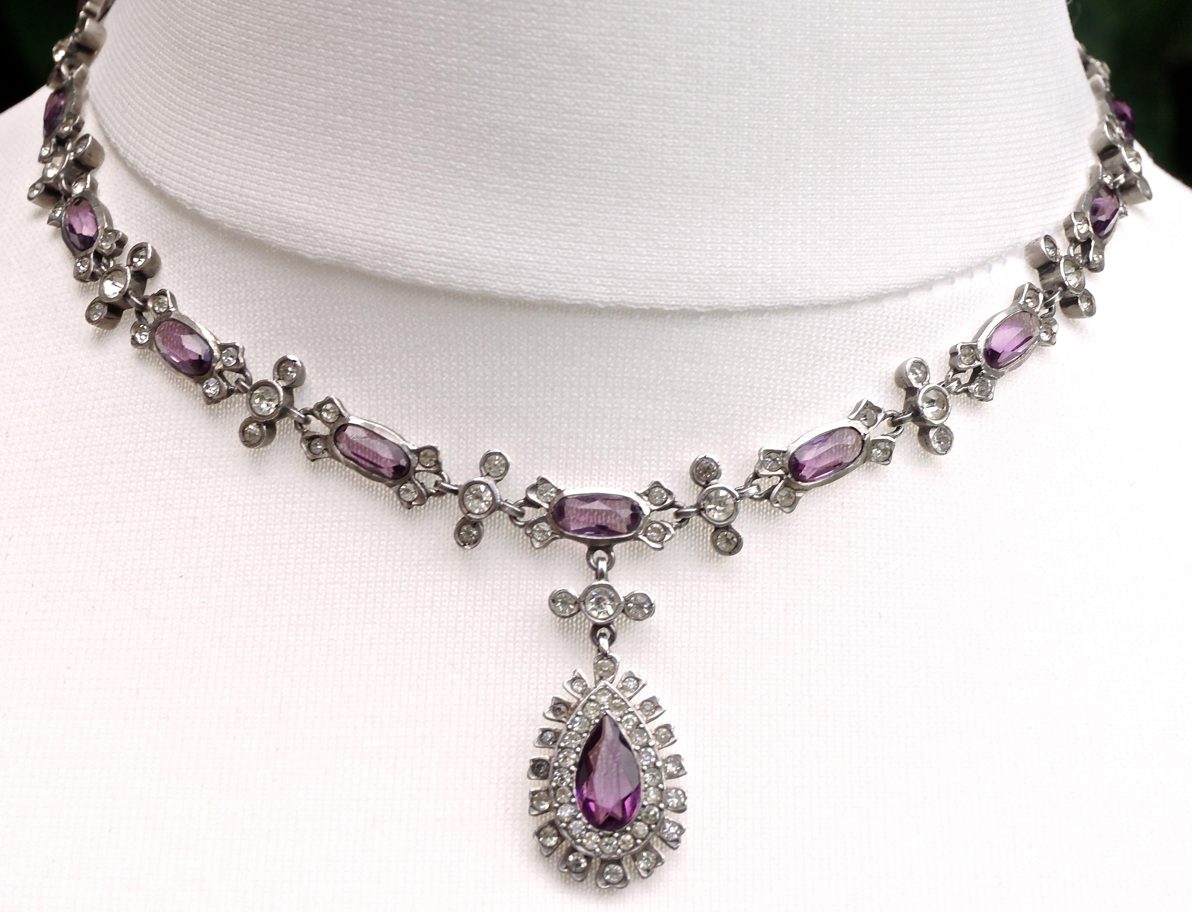 Beautiful antique sterling silver lavalier necklace with white and soft amethyst paste stones, stamped 'Sterling' on the reverse of the pendant. This necklace is of rather a grand design, imitating an amethyst and diamond necklace, and featuring a