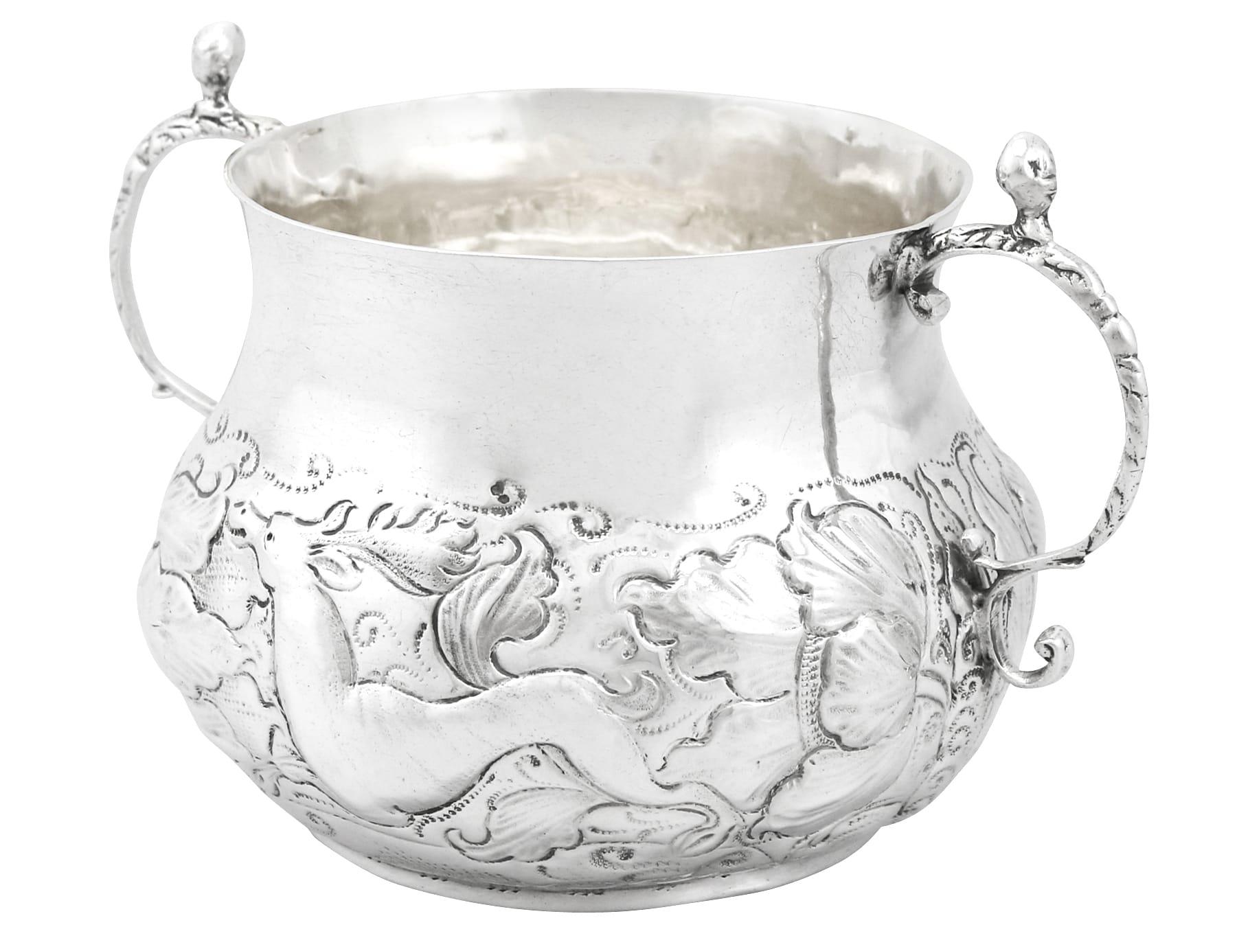 An exceptional, fine and impressive antique Charles II English sterling silver porringer; part of our collectable silverware collection.

This exceptional antique Charles II sterling silver porringer has a circular rounded form onto a collet