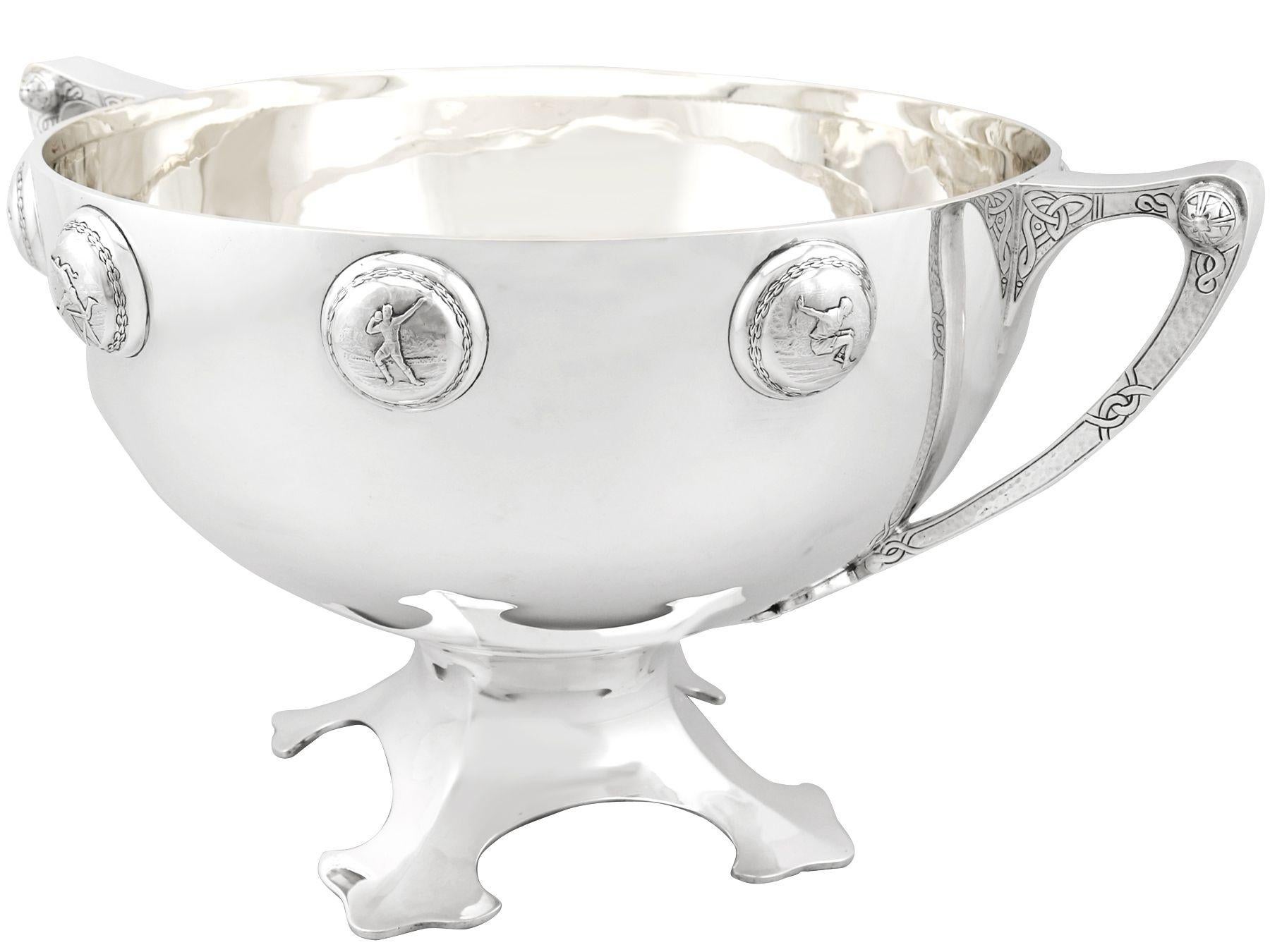A magnificent, fine and impressive antique George VI English sterling silver presentation bowl with sporting interest, an addition to our 1930s ornamental silverware collection.

This exceptional antique 1930s sterling silver bowl has a circular