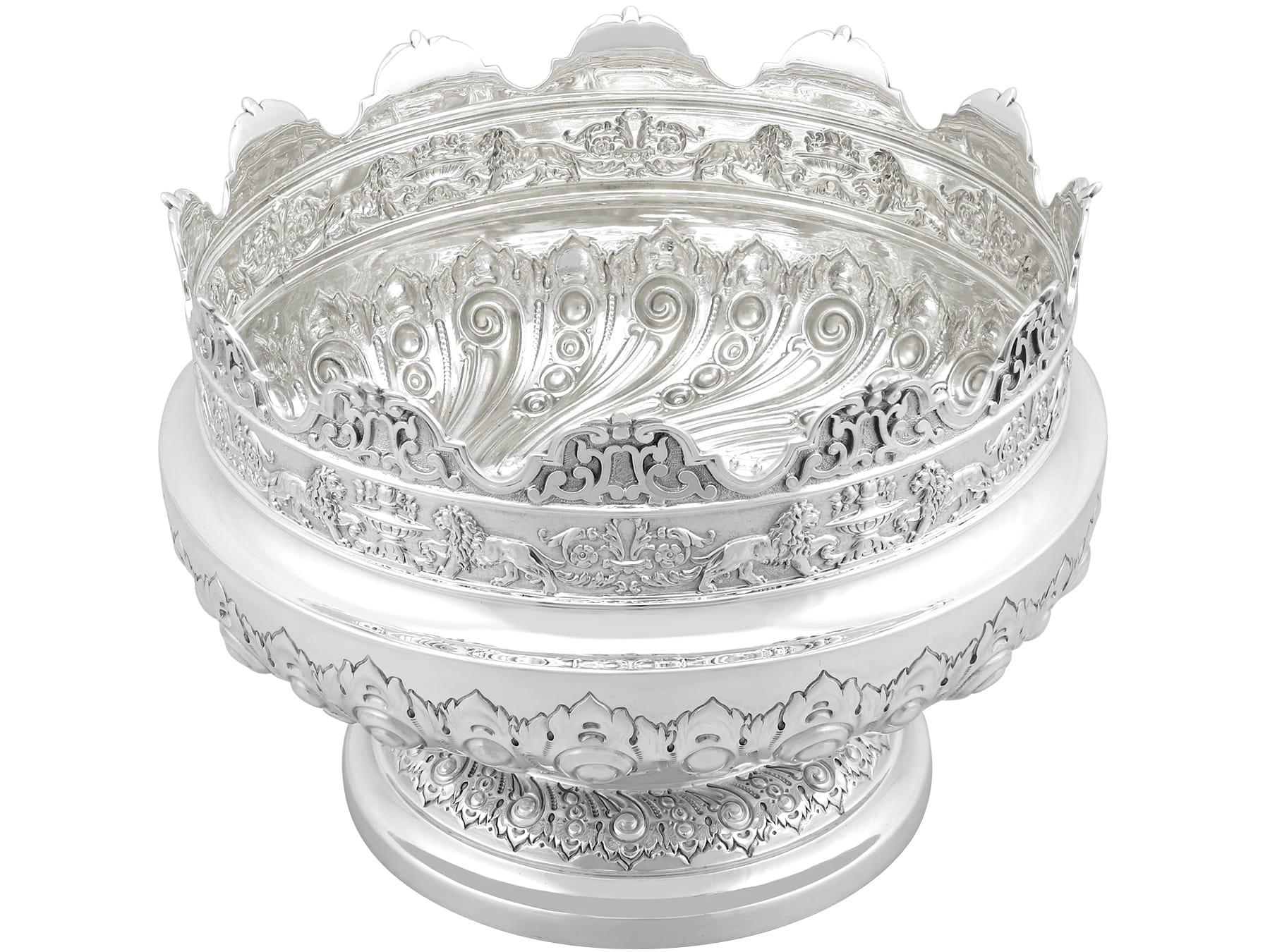 An exceptional, fine and impressive antique Victorian English sterling silver Monteith style presentation bowl; an addition to our ornamental silverware collection.

This exceptional antique Victorian sterling silver bowl has a circular form onto a