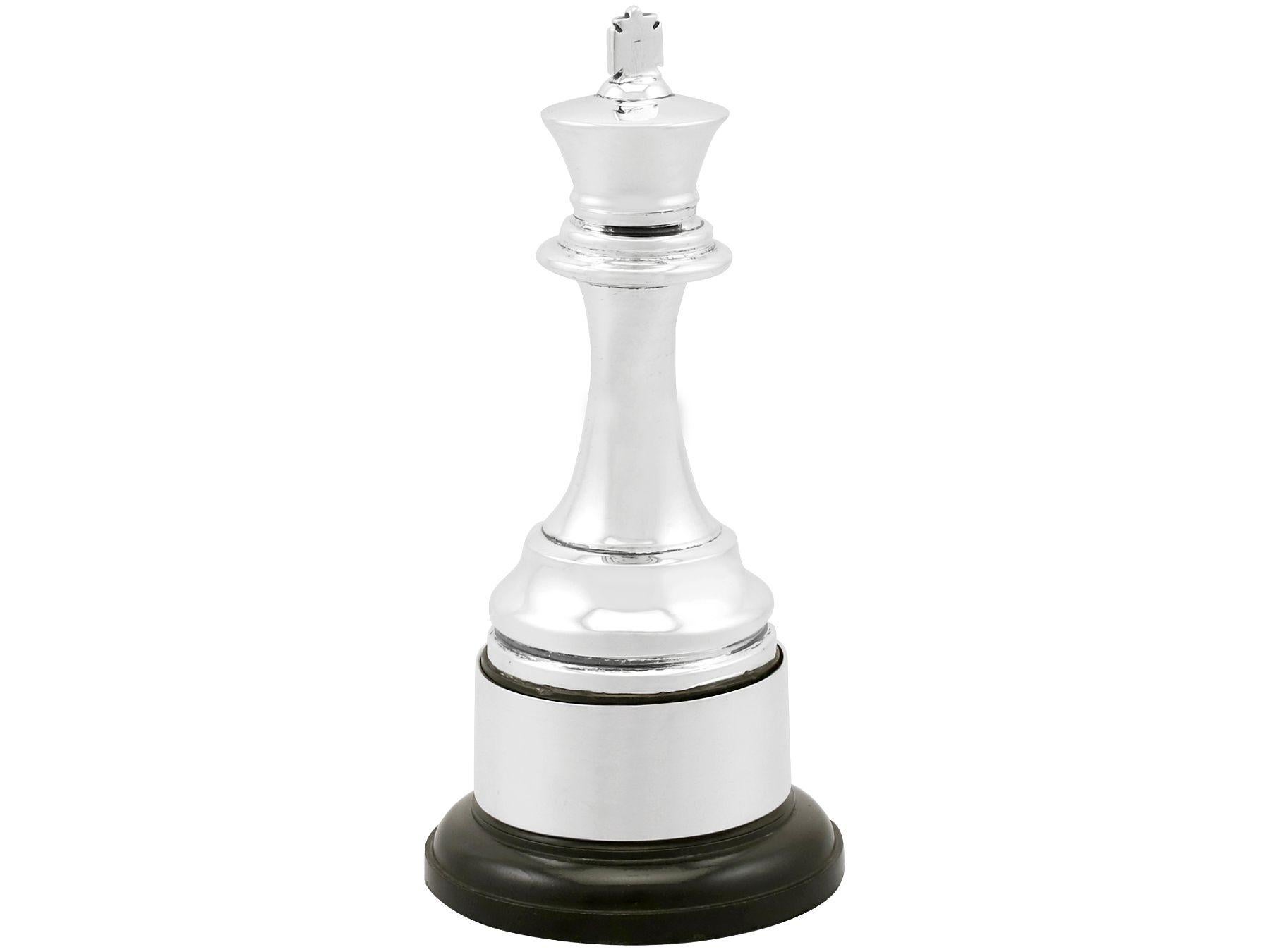 An exceptional, fine and impressive antique George V English sterling silver presentation trophy in the form of a king chess piece; an addition to our ornamental office silverware collection.

This exceptional antique George V sterling silver