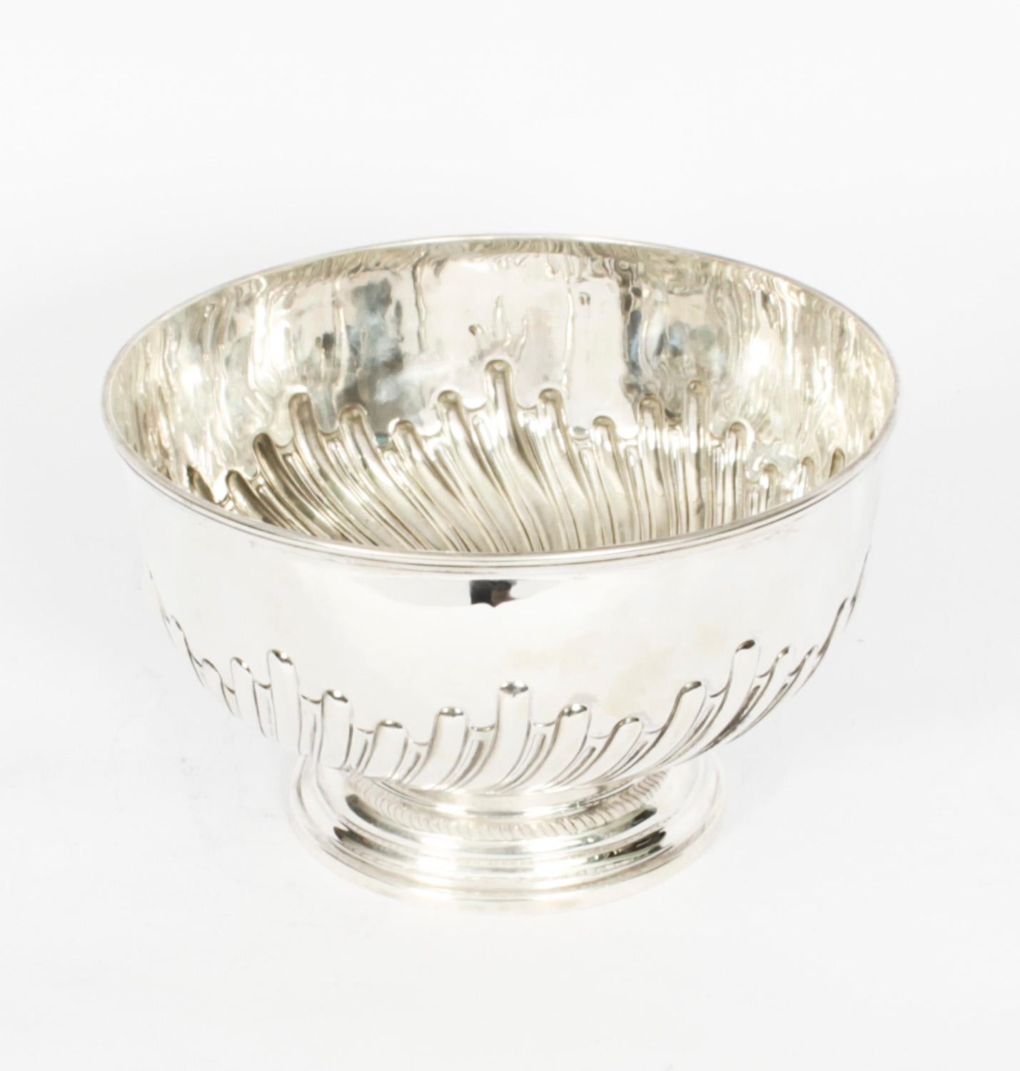 This is a large gorgeous antique Victorian sterling silver punch bowl bearing the makers mark of the renowned silversmiths Walker & Hall and hallmarks for Sheffield 1893.
 
This exquisite punch bowl is also ideal as a champagne cooler and it has