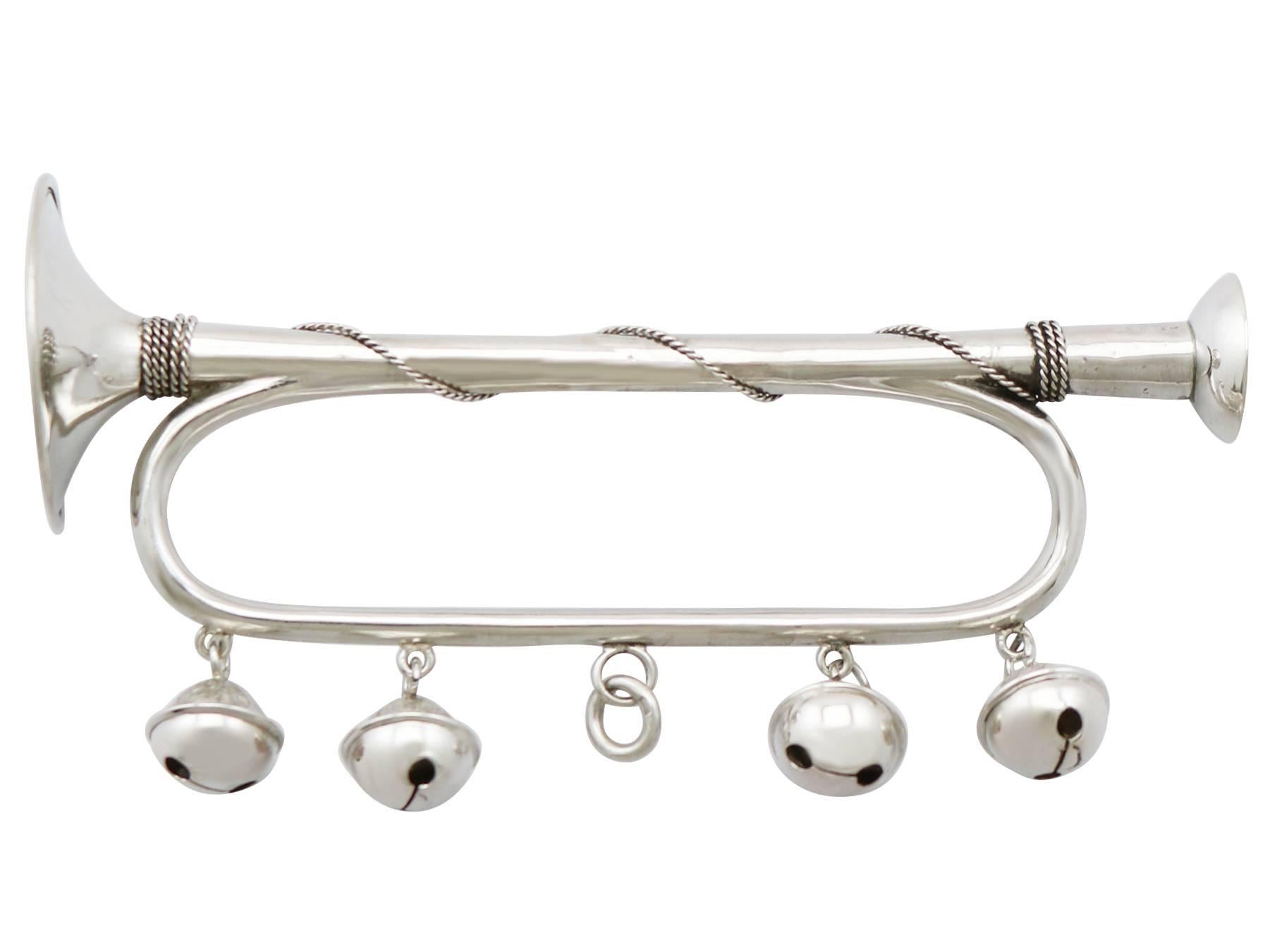 A fine and impressive antique Victorian sterling silver rattle modelled in the form of a trumpet; part of our diverse silverware collection.

This exceptional antique Victorian sterling silver baby rattle has been modelled in the form of a