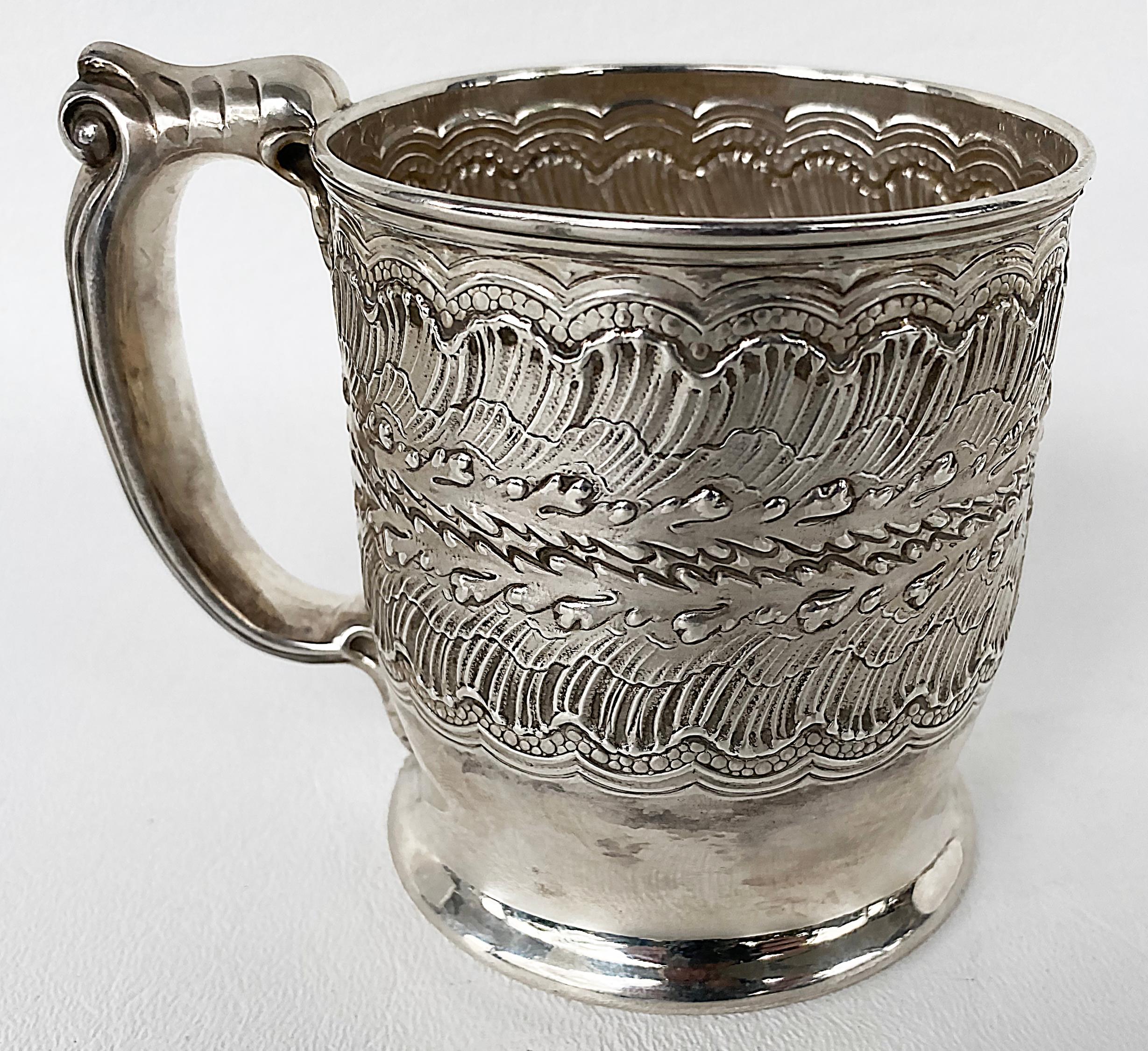 Antique sterling silver Repousse Baby cup with handle, Circa 1900

Offered for sale is an antique sterling silver repousse baby cup with a handle. The repousse is used in conjunction with chasing to create a fan and water pattern that surrounds
