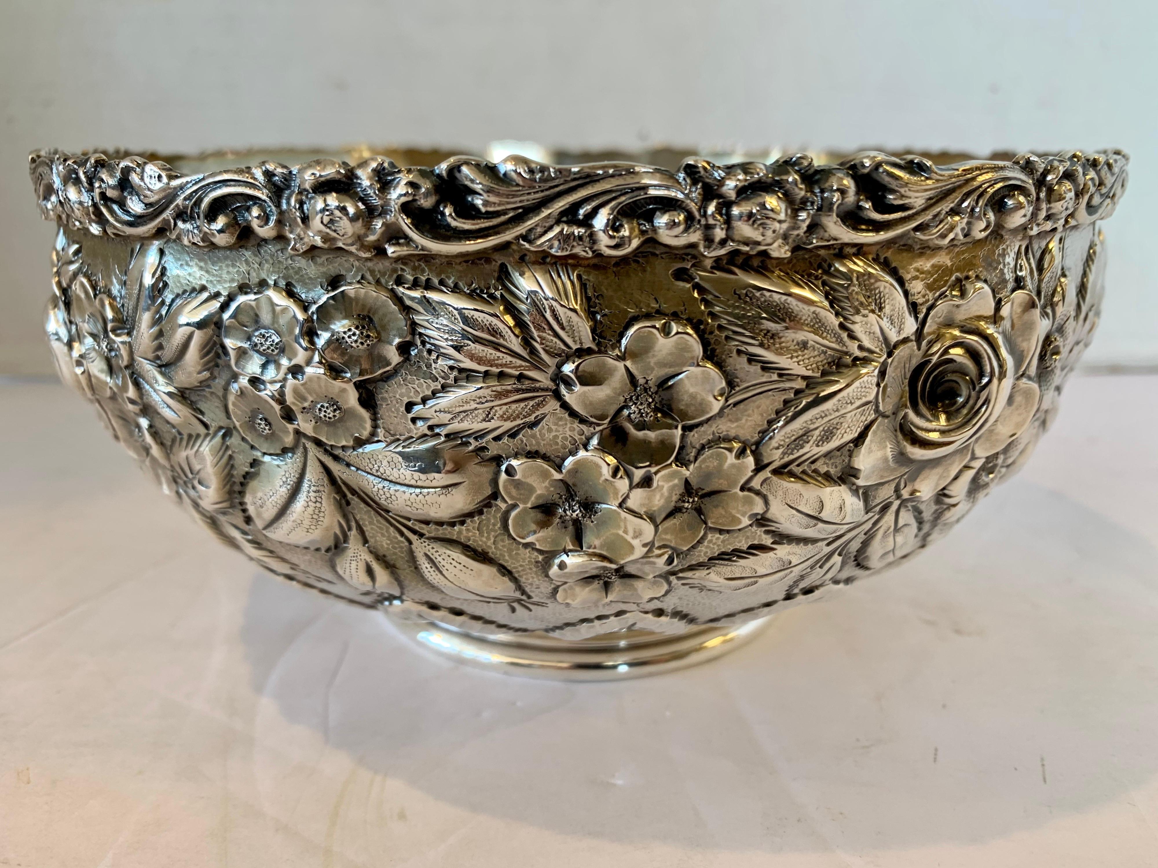 Stunning antique repousse serving bowl with intricate detail throughout. One of the most magnificent piece of repousse available; the detail is like a work of art. Now, more than ever, home is where the heart is. Troy ounce weight is 16.75.