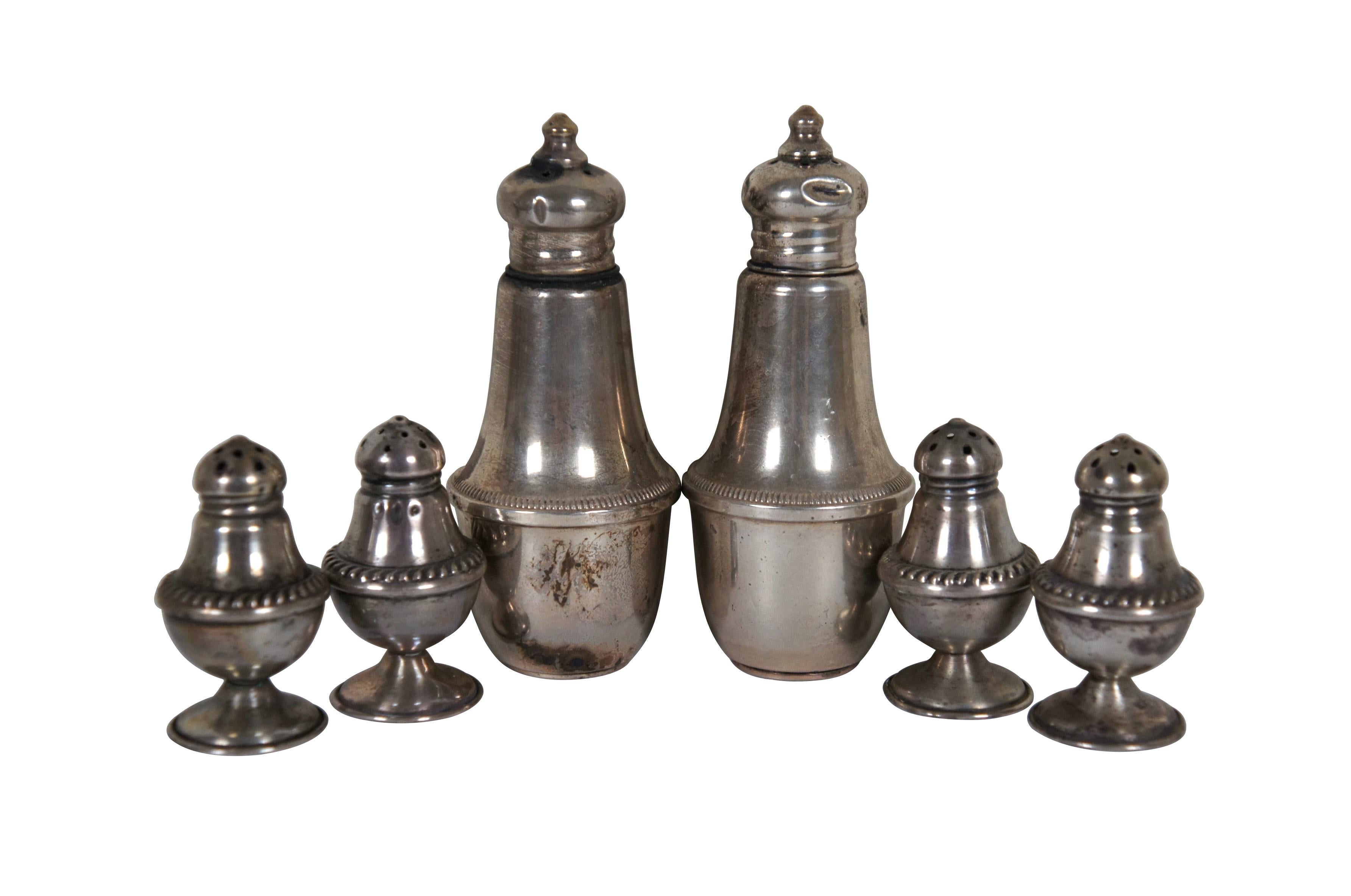 Lot of 10 assorted pieces of antique and vintage sterling silver salt cellars and pepper shakers. Includes: four (two pairs) miniature number 18 salt and pepper shakers by Dunkirk Silversmiths, two number 2075 scalloped edge salt cellars by Gorham