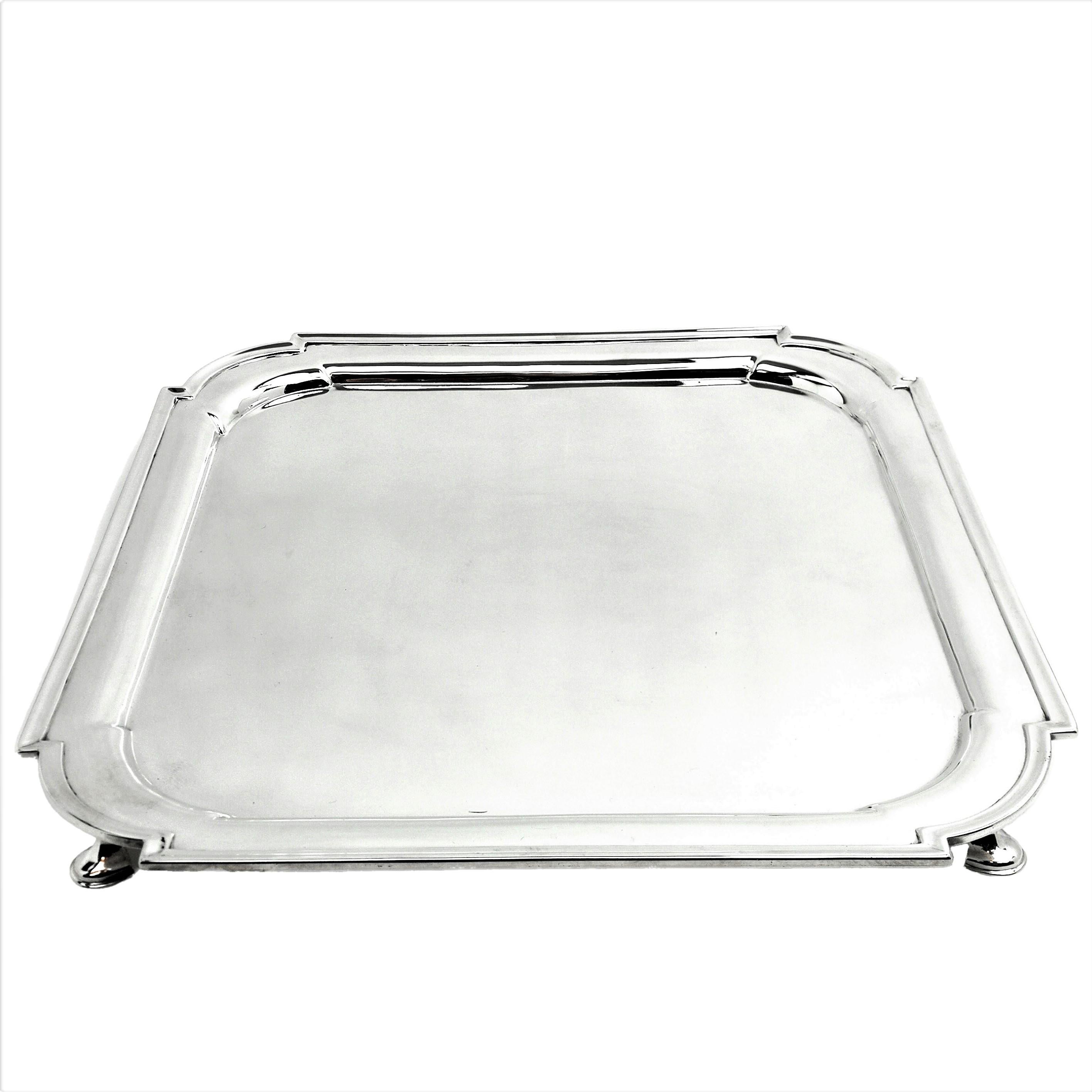An elegant antique solid Silver Salver in a square shape with shaped corners and standing on four hoof feet. This Tray is highly polished and is suitable for engraving.
 
 Made in London in 1903 by Lamberts.
 
 Approx. Weight - 974g / 31.3oz
Approx.