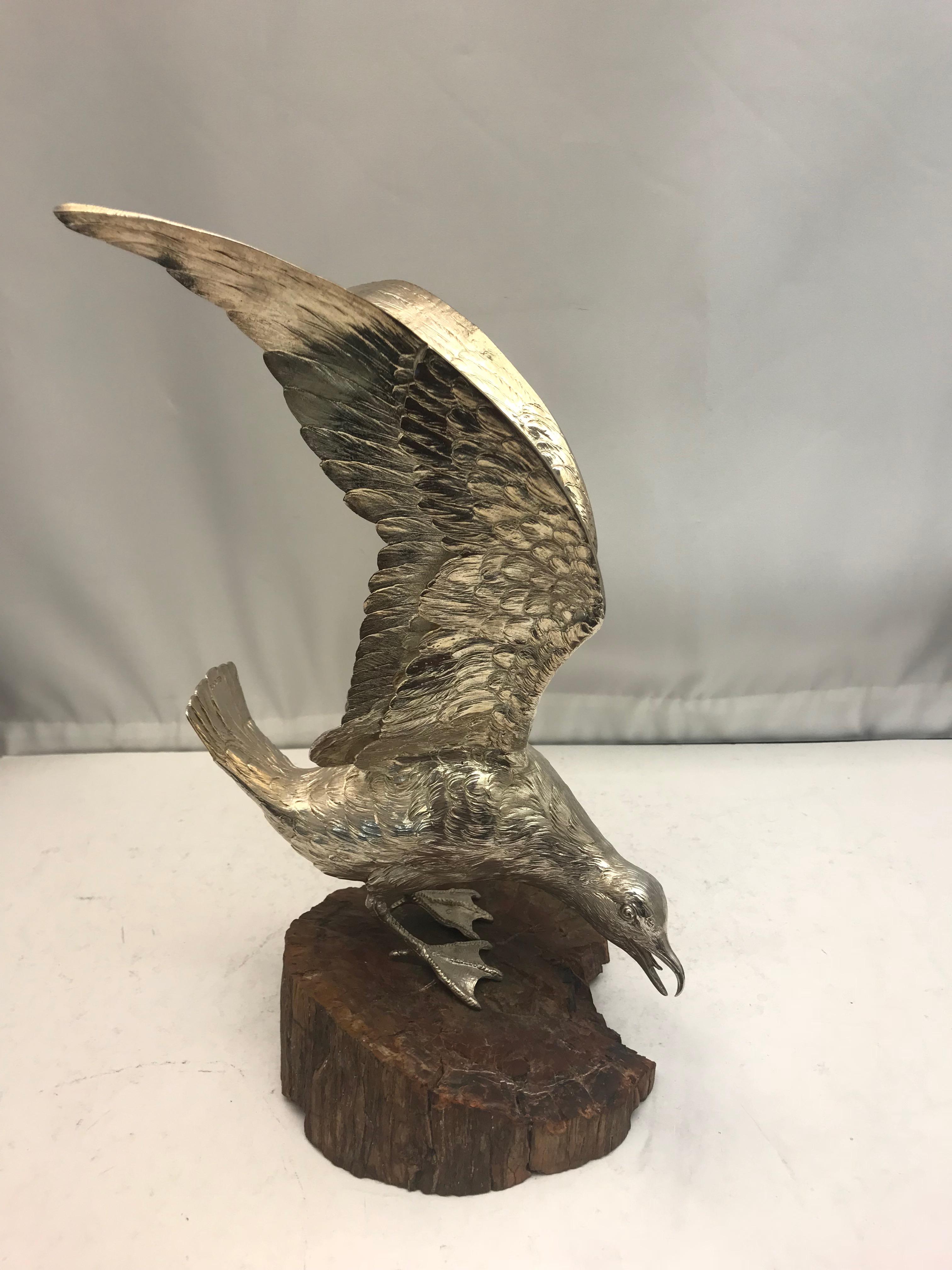 A large antique sterling silver model of a seagull on a stone base. 

Imported in 1910.