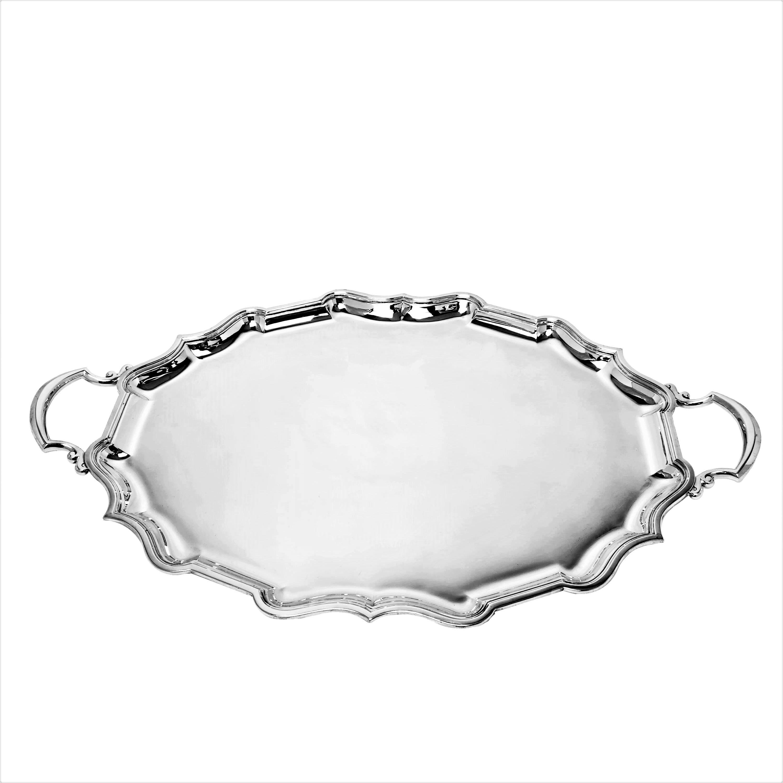 A large Sterling Silver two handled serving Tray with a traditional bath border. The Tea Tray is suitable for a substantial tea set and is an ideal serving tray.

Made in Sheffield, England in 1915 by Elkington & Co.

Approx. Weight - 2862g /