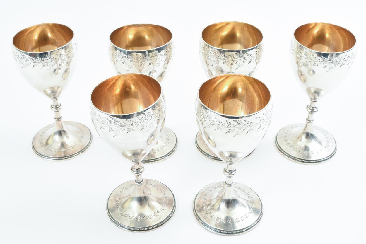 Antique sterling silver set of six barware / tableware drinking cups with gold wash interior. Each cup is in excellent antique condition. 24.79 troy ounces. Each cup measure about 5 inches high x 2.5 inches base diameter.