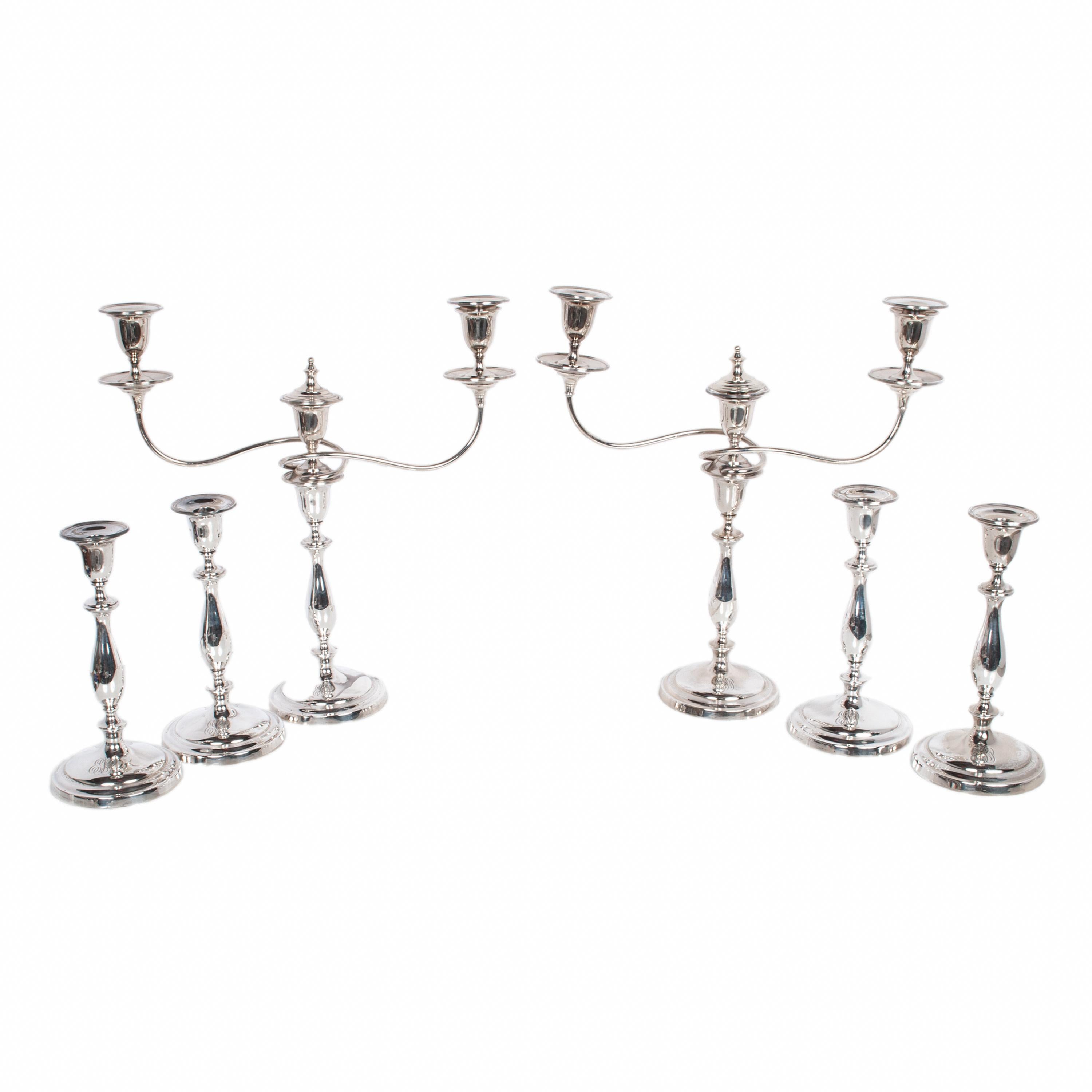 A fine & rare set of six antique Sterling silver candelarbrum and candlesticks Ellis & Co (Ellis Jacob Greenberg) London & Birmingham 1925.
There are six matching cirular based candlesticks, two with three light candelarbra arms, each candlestick