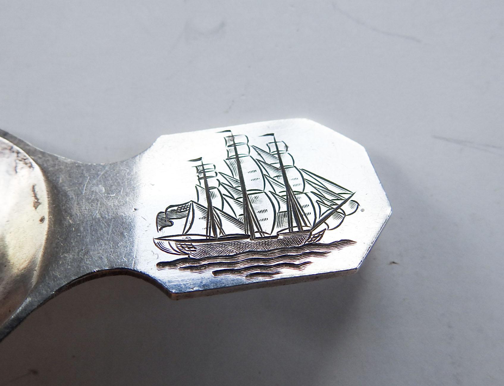 Early 20th century sterling silver tea caddy spoon.  Hand hammered bowl, detailed hand engraved rendering of a sailing ship flying the American flag.  Marked 925-000 H on back, maker not known, surface scuffing.