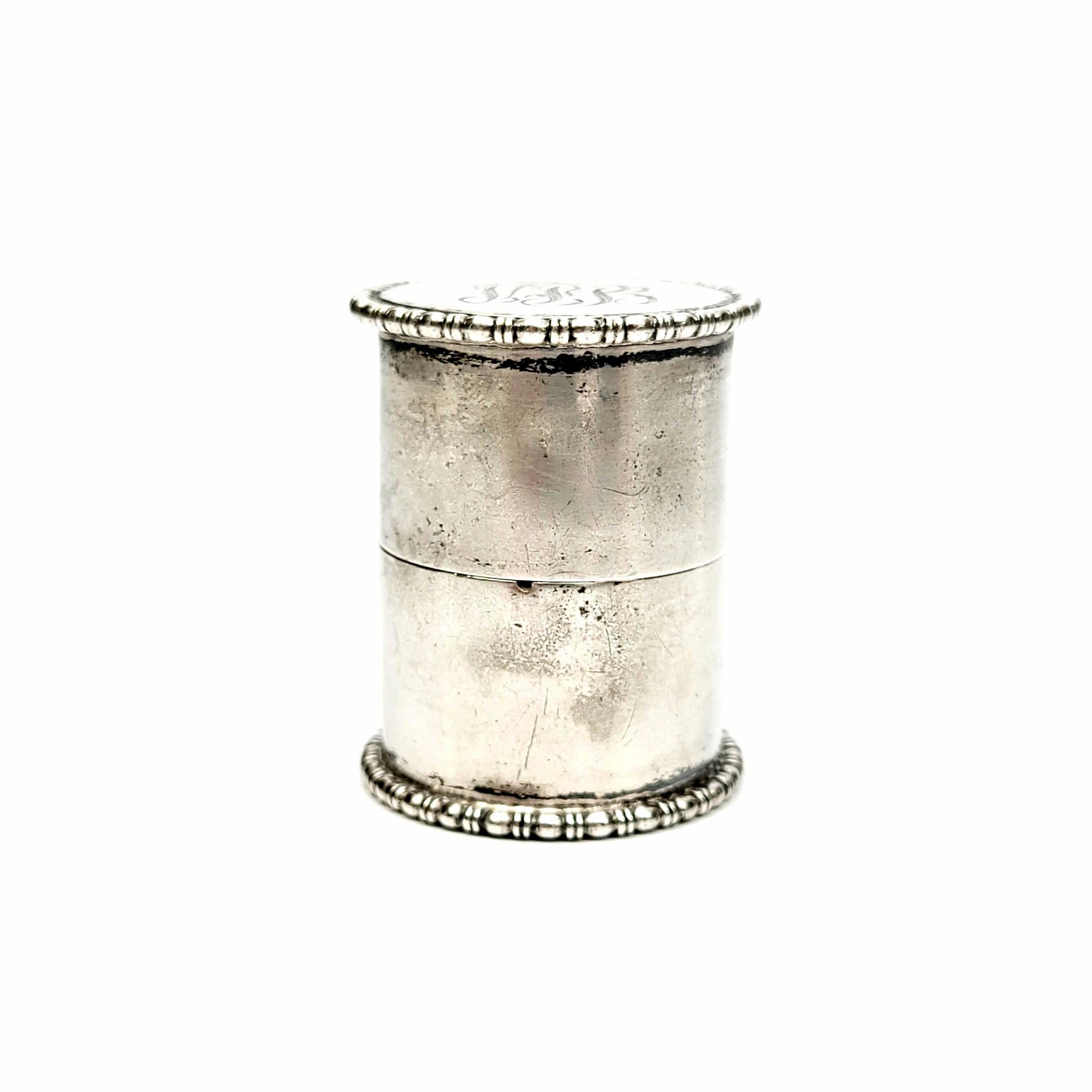 Antique sterling silver round canister to hold thread.

This thread holder features a simple beaded design along the top and bottom. Monogram on the top.

Monogram appears to be VPB.

Measures 1 1/2