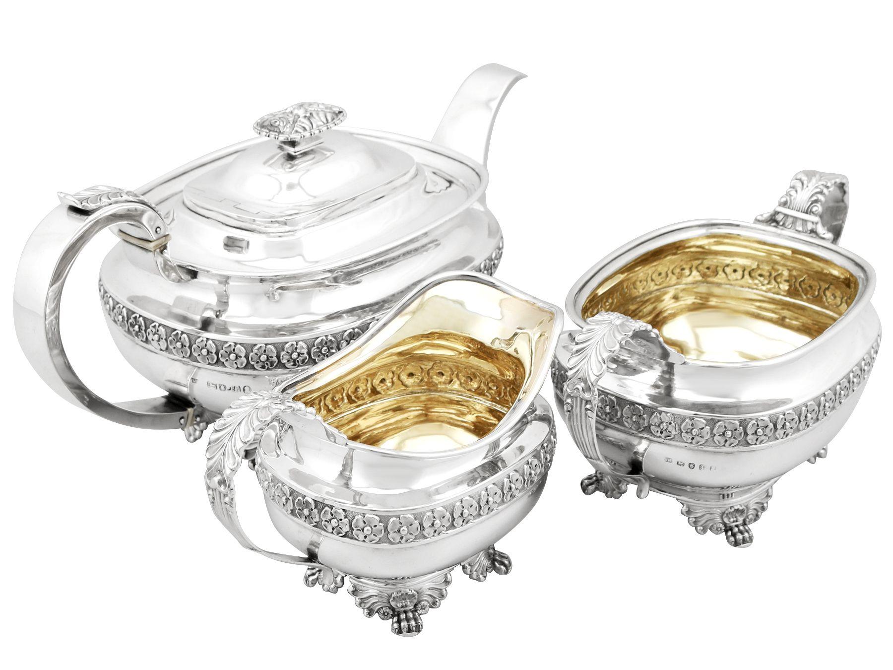 An exceptional and impressive antique George IV English sterling silver Regency style three piece tea service/set; an addition to our silver teaware collection.

This antique George IV sterling silver three piece tea service consists of a teapot,