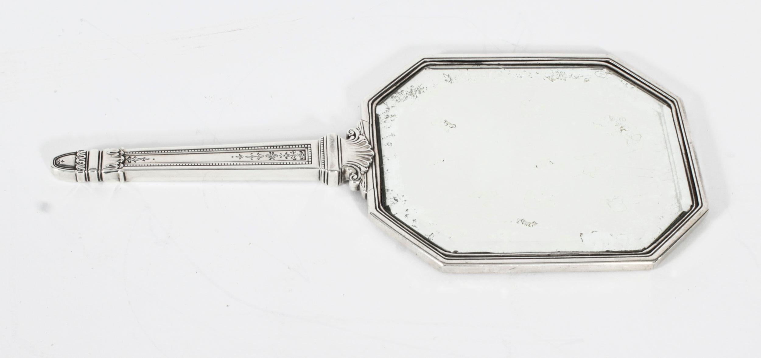 This is a wonderful antique Edwardian sterling silver hand-mirror with marks for 925 sterling silver, the maker's mark of the renowned silversmiths Tiffany & Co., and Circa 1900 in date.
 
The vanity mirror features heavy engraved and embossed