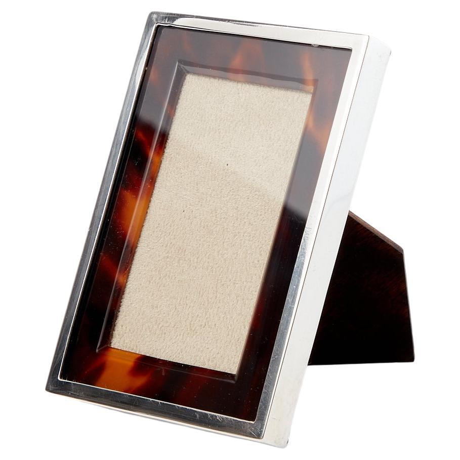 Presenting an exquisite Antique Sterling Silver & Tortoiseshell Photo Frame, crafted in London in 1905 by John Bodman Carrington.

This beautiful frame displays a delightful patina that enhances its color and pattern. Both the silver and