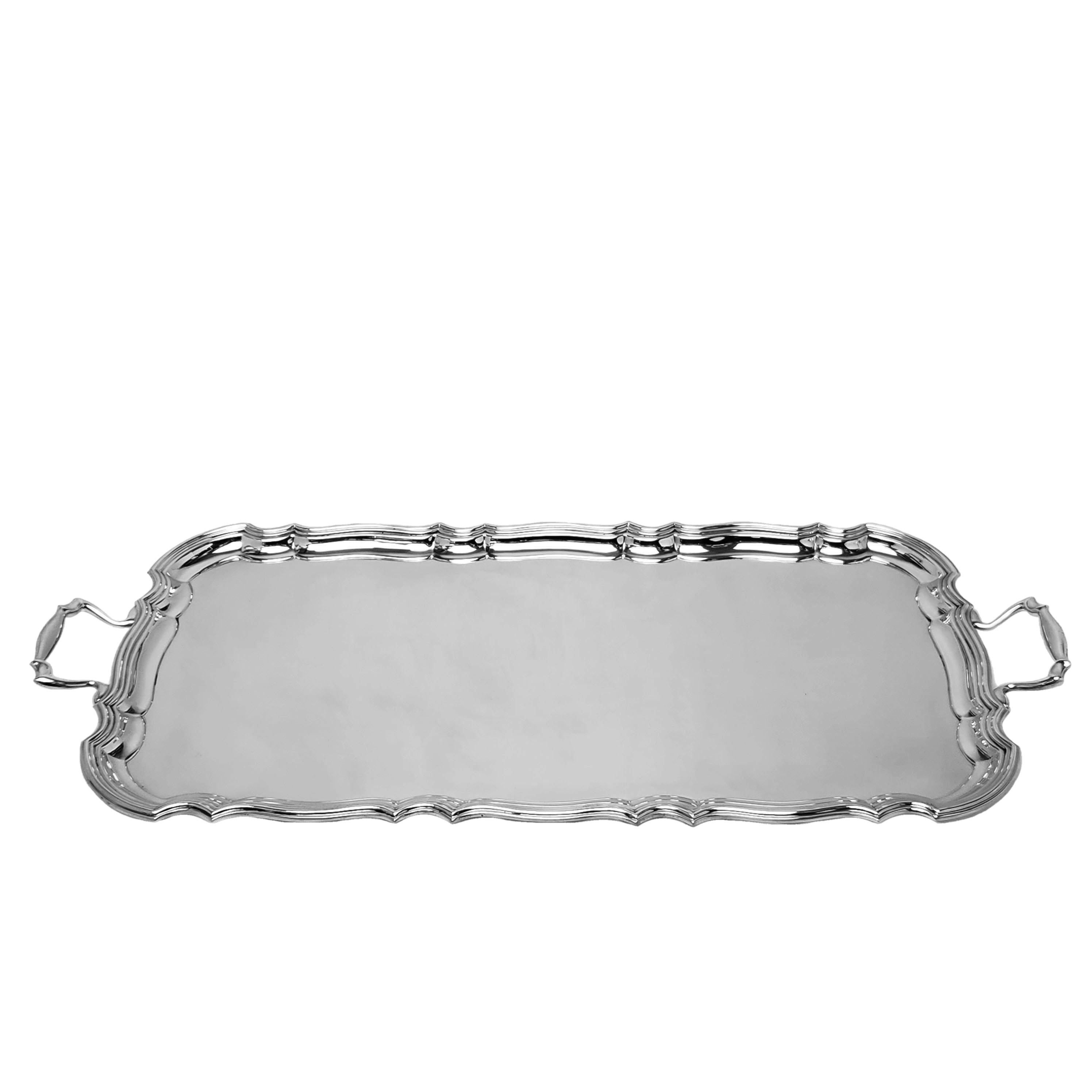 Am elegant Antique Sterling Silver Serving Tray with a Chippendale style border. This Two handled Tray is suitable as a Sandwich Tray but sizable enough for serving.

Made in Birmingham in 1915 by Barker Bros
 
Weight - 1642g / 52.8oz
Length incl