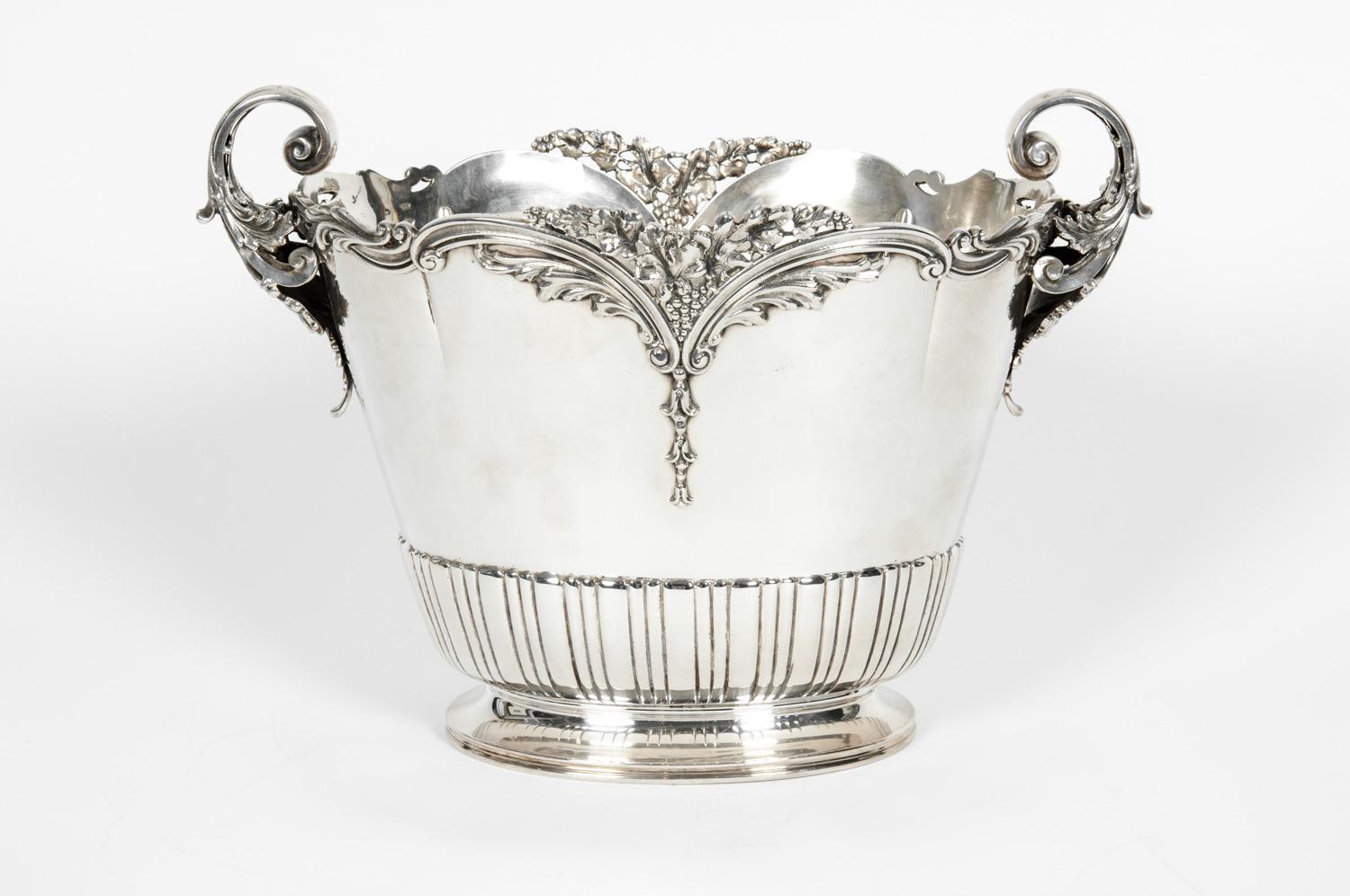 Large antique sterling silver wine cooler with two side handles or barware piece with exterior design details. The barware or wine cooler is in excellent condition, maker's mark undersigned. The piece measure about 14 inches long x 8 inches width x