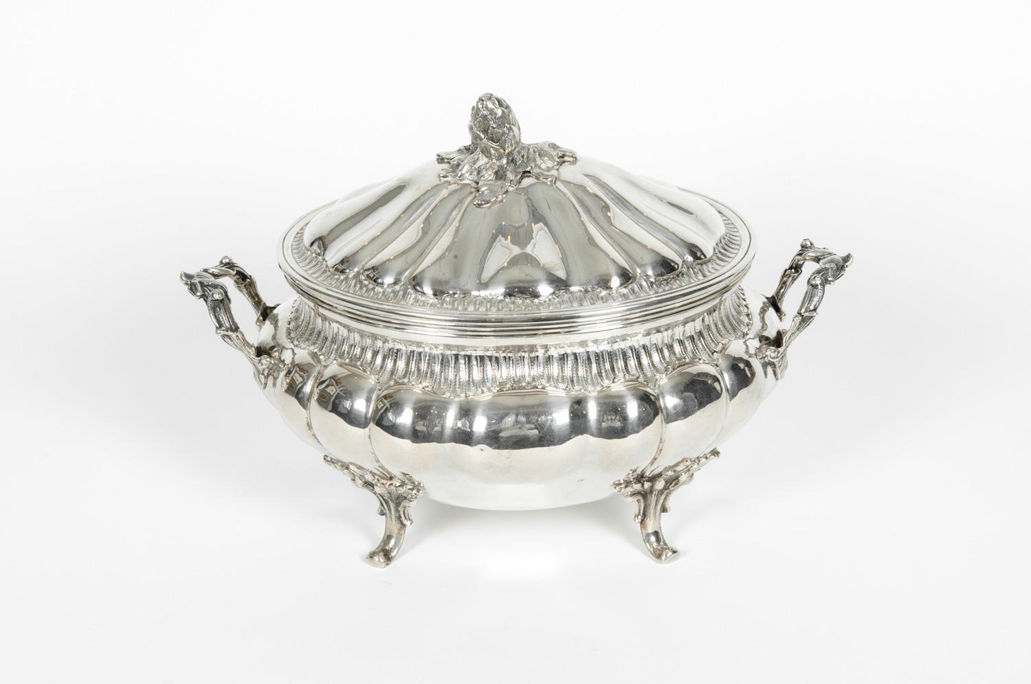 Antique sterling silver two pieces covered tureen with side handles. The covered tureen is in excellent antique condition, maker's mark undersigned. The covered tureen measure about 15 inches long x 8.5 inches width x covered 10.5 inches high.