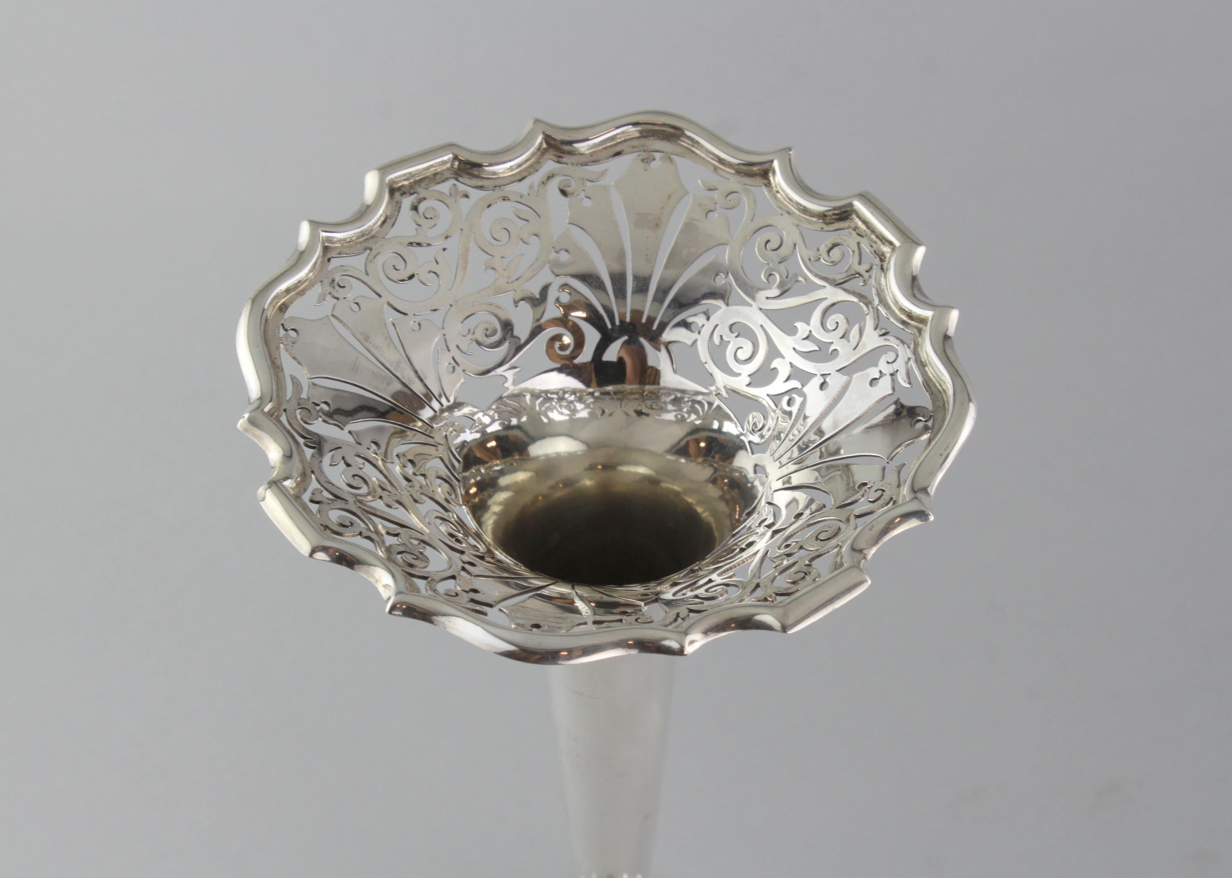 Antique sterling silver vase
Maker: Walker & Hall
Made in Sheffield 1911, United Kingdom
Fully hallmarked.

Dimensions - 
Diameter 11.8 cm
Height 25.7 cm
Weight 374 grams

Condition: Vase is pre-owned, minor signs of usage, no damage, excellent